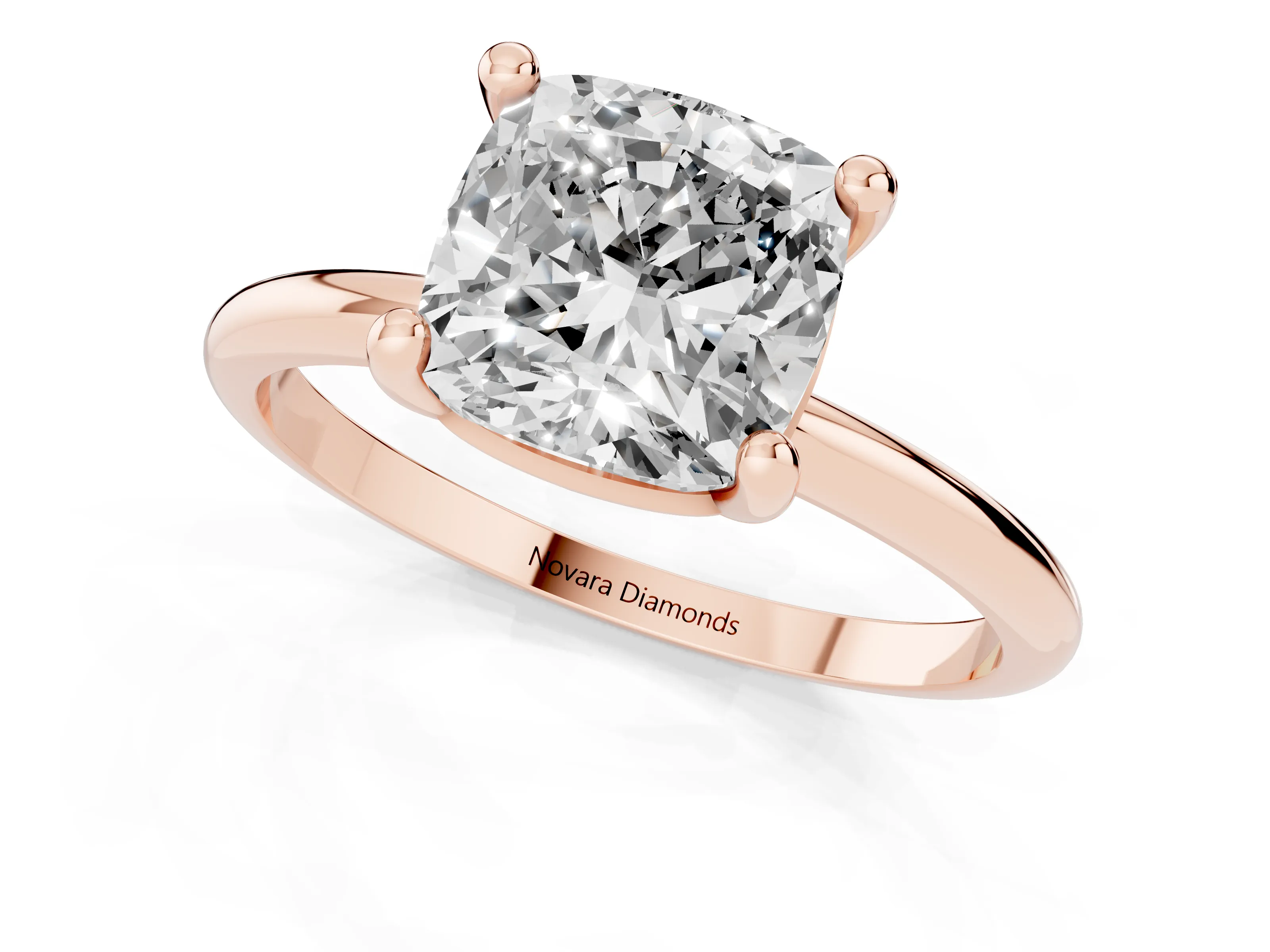 Cushion Cut Diamond Solitaire Ring Set in Rose gold with Secure Prong Setting on a Classic Band