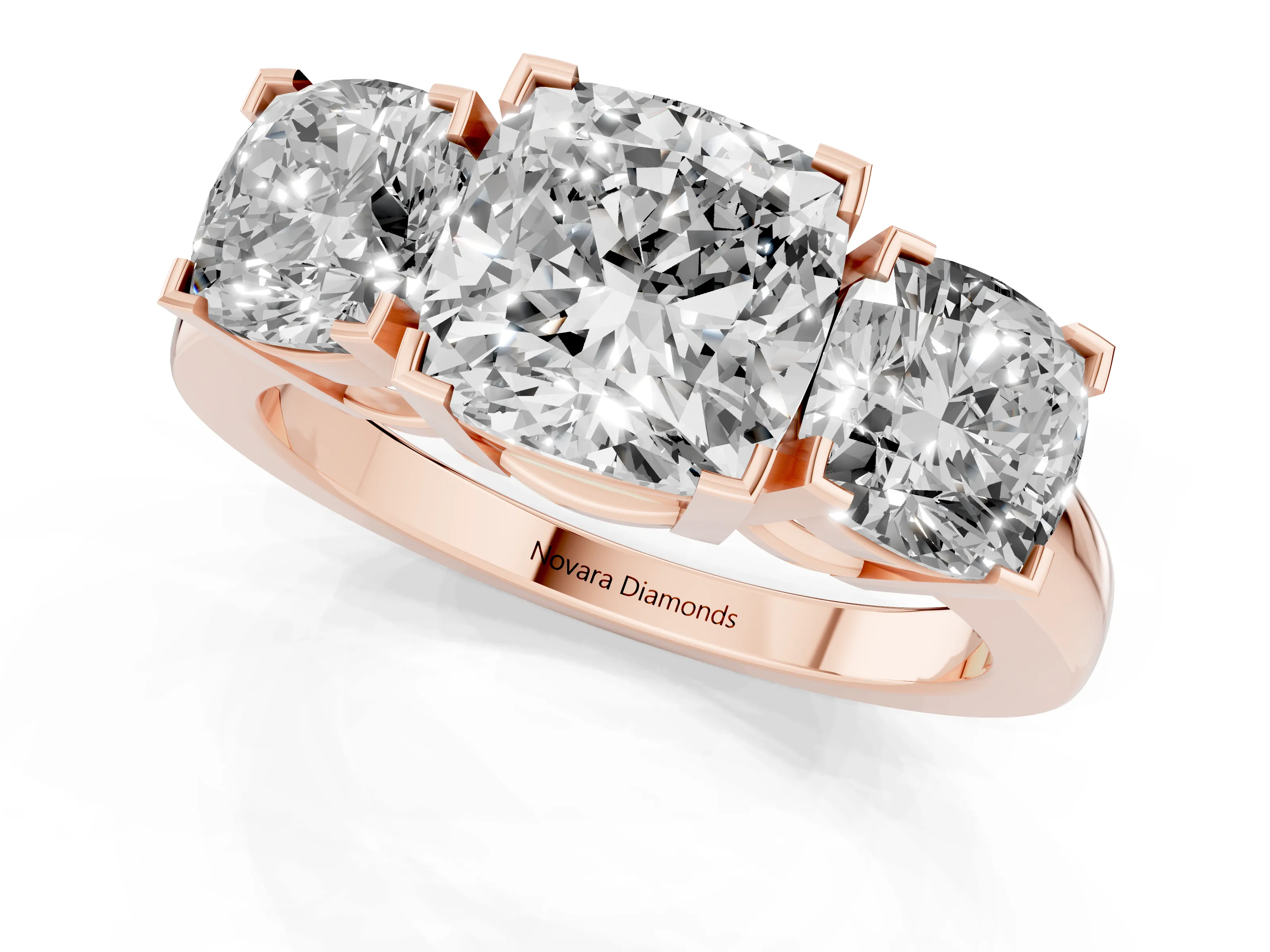 Cushion Cut Diamond Three-Stone Ring Set in Rose gold with Channel-Set Band and Prong Settings