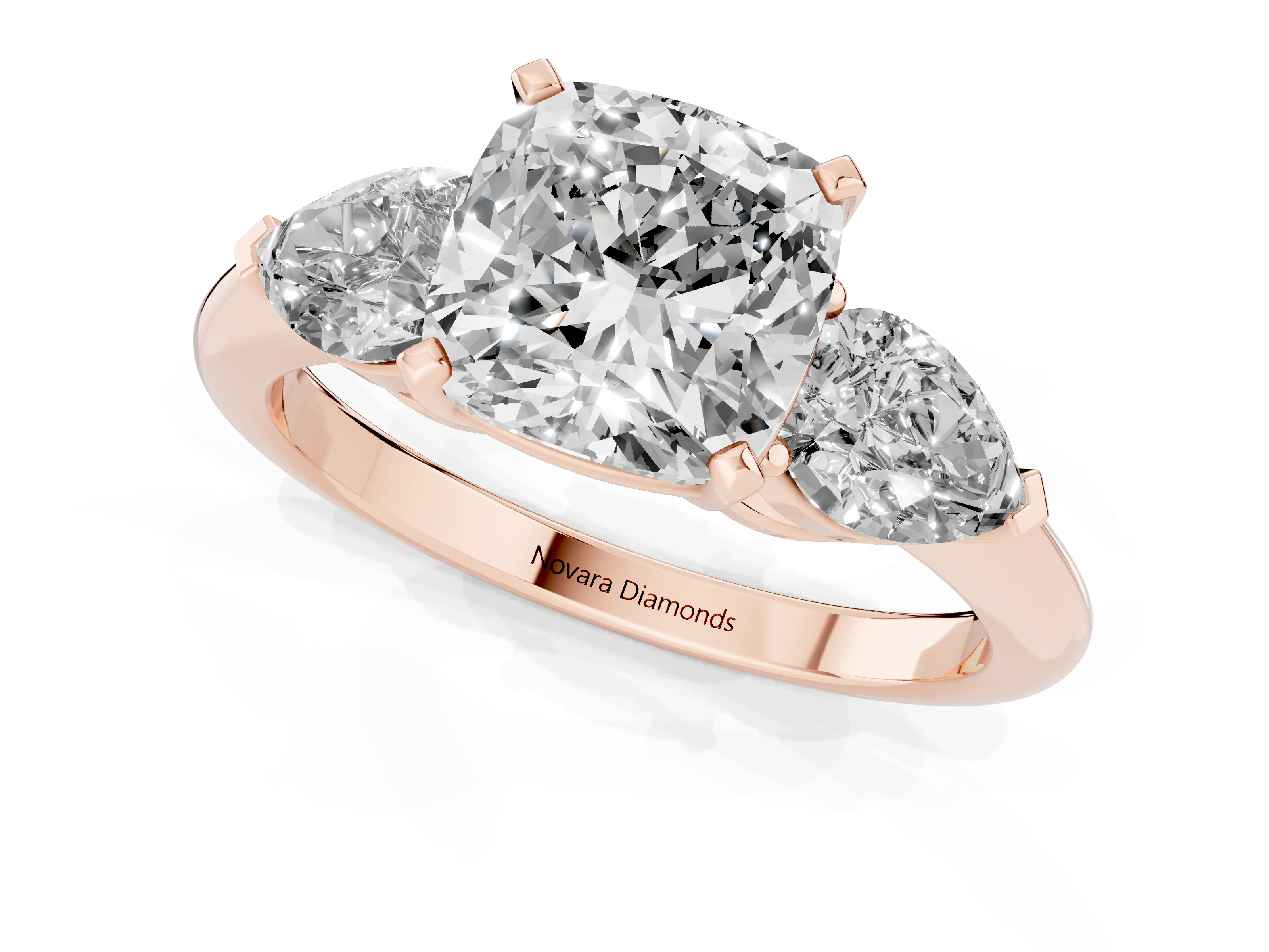 Three-Stone Cushion Cut Diamond Ring Set in Rose gold with Pear Side Stones and Prong Setting