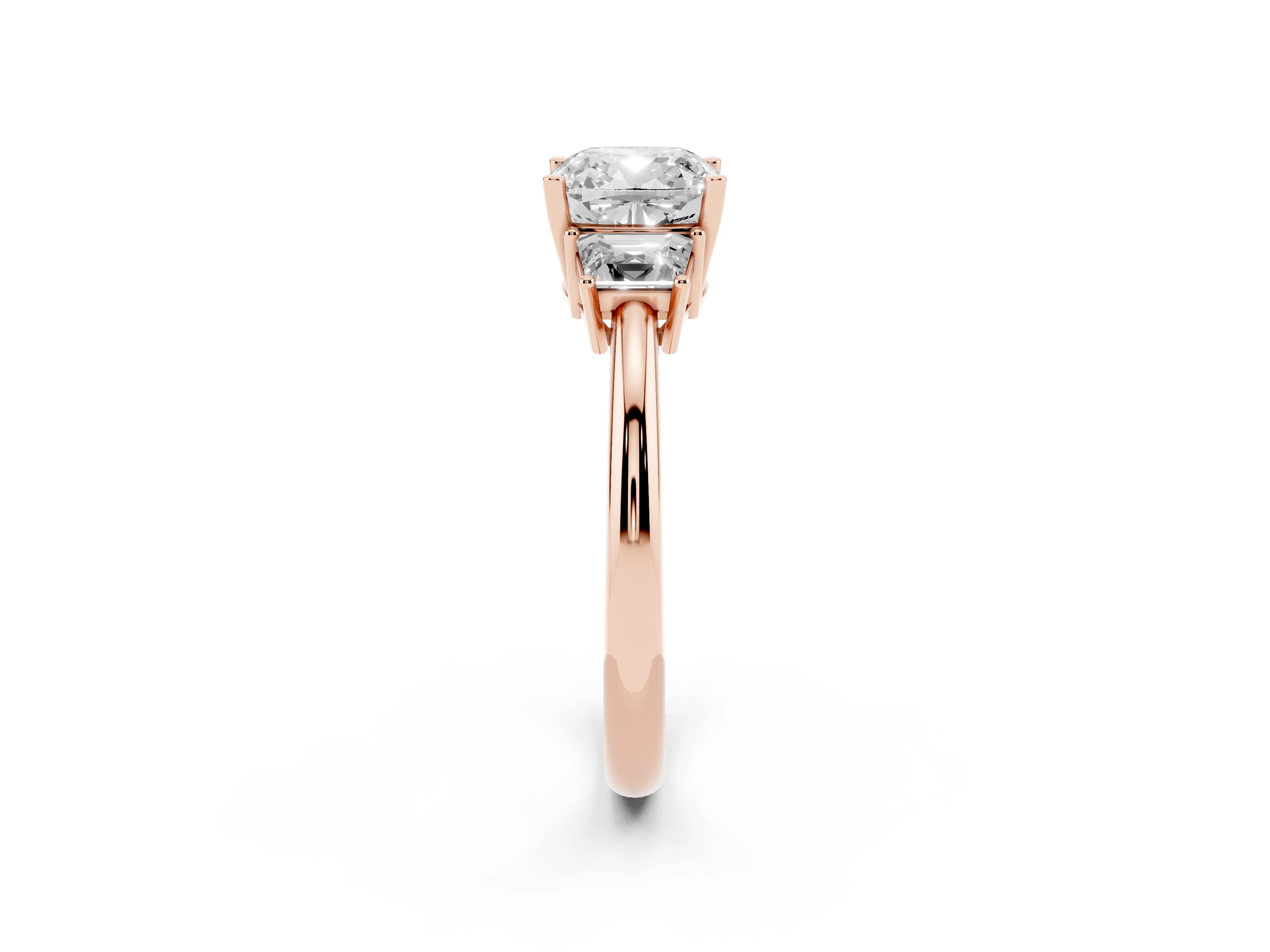 Cushion Cut Diamond Three-Stone Ring Set in Rose gold with Trapezoid Side Stones and Prong Setting