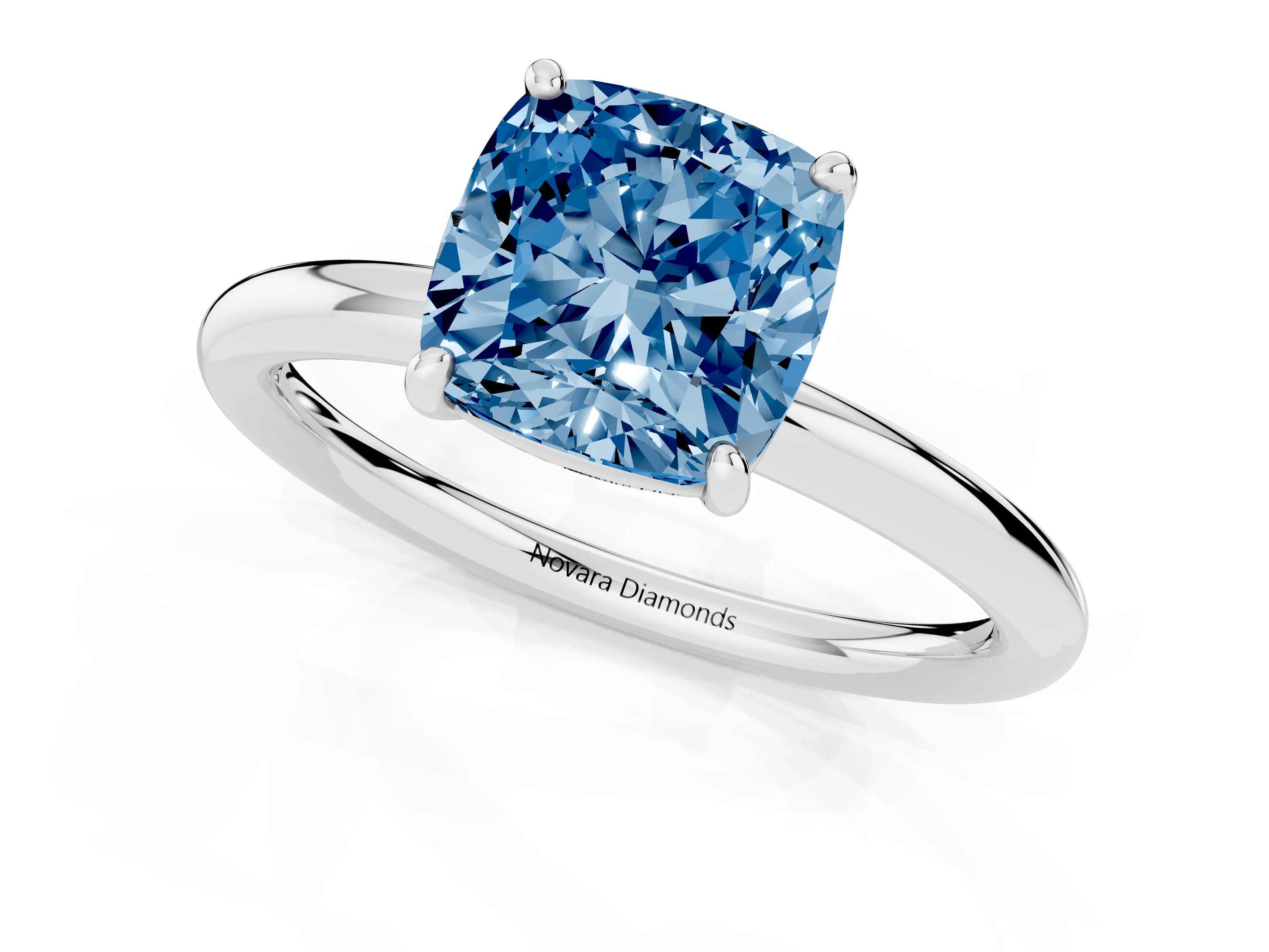 Fancy Blue Cushion Cut Diamond Solitaire Ring Set in Silver with Prong Setting on a Polished Plain Band