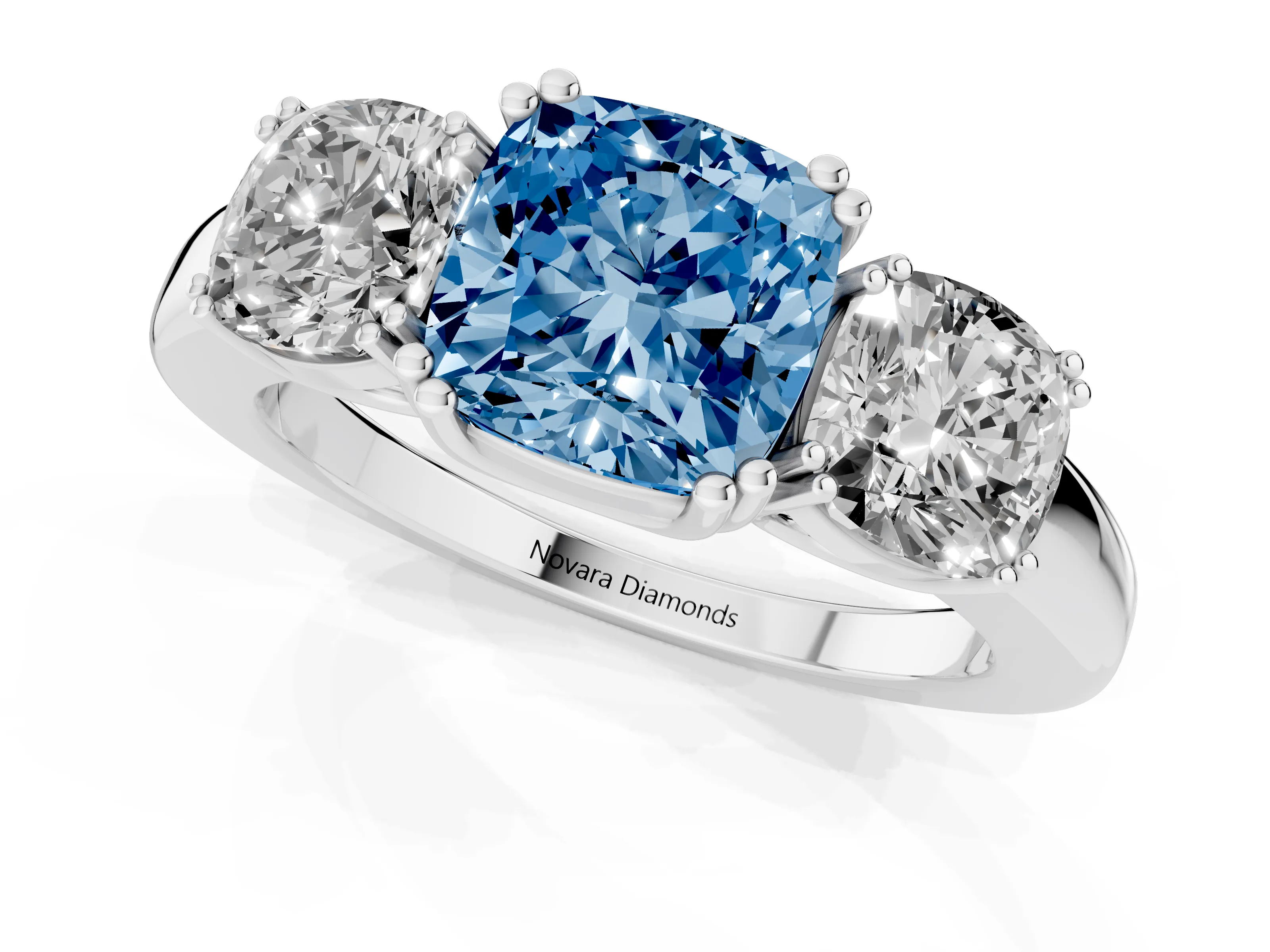 Fancy Blue Cushion Cut Diamond Three-Stone Ring Set in White gold with Polished Band and Prong Setting