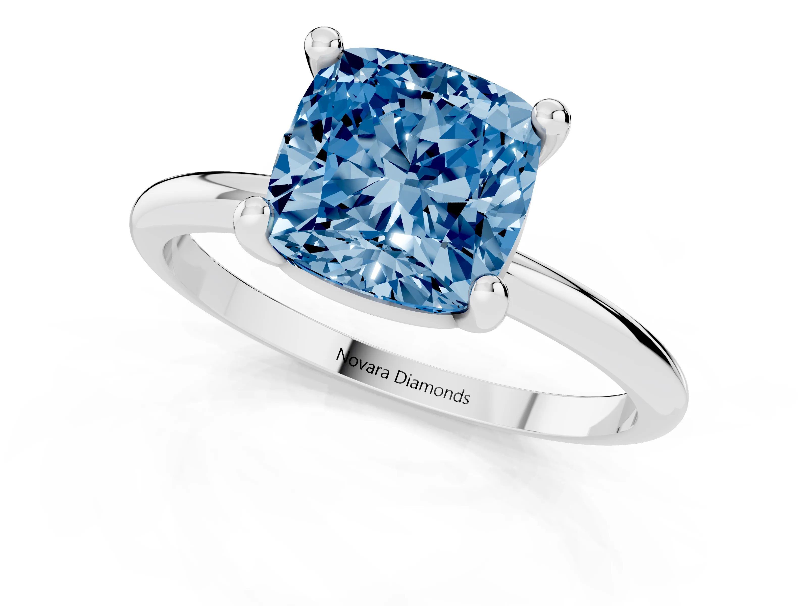 Fancy Blue Cushion Cut Diamond Solitaire Ring Set in White gold with Secure Prong Setting on a Classic Band