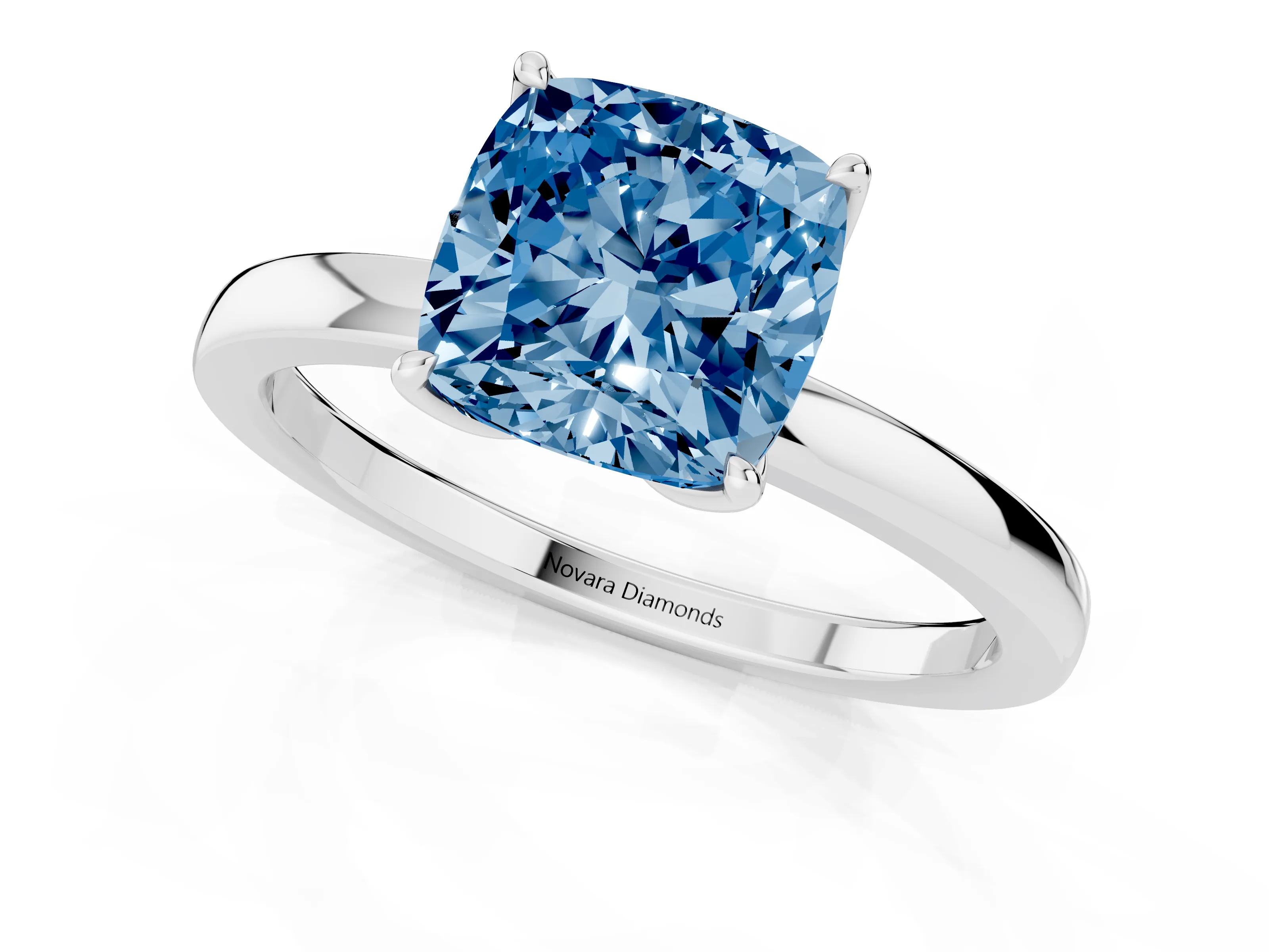 Fancy Blue Cushion Cut Diamond Solitaire Ring Set in White gold with Prong Setting and Thin Polished Band