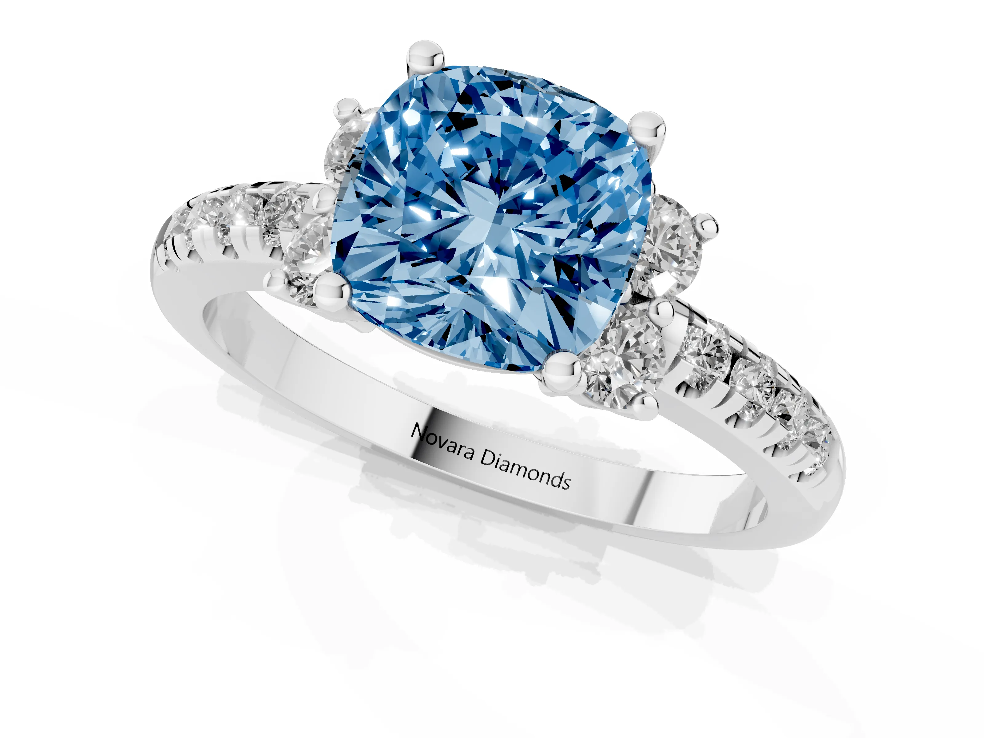 Fancy Blue Cushion Cut Diamond Three-Stone Pavé Ring Set in White gold with Prong Setting