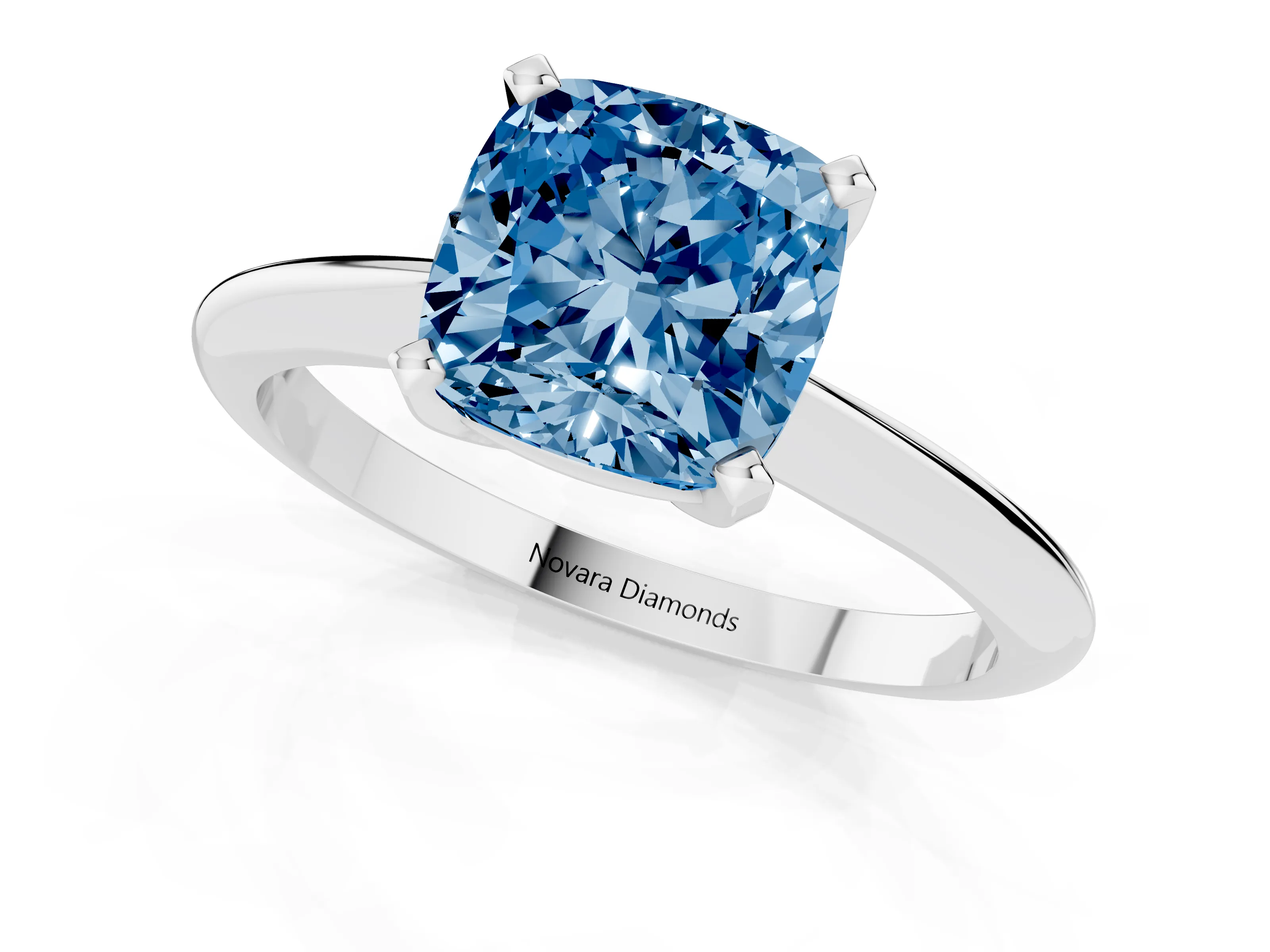 Fancy Blue Cushion Cut Diamond Solitaire Ring Set in Platinum with Prong Setting on a Plain Round Band