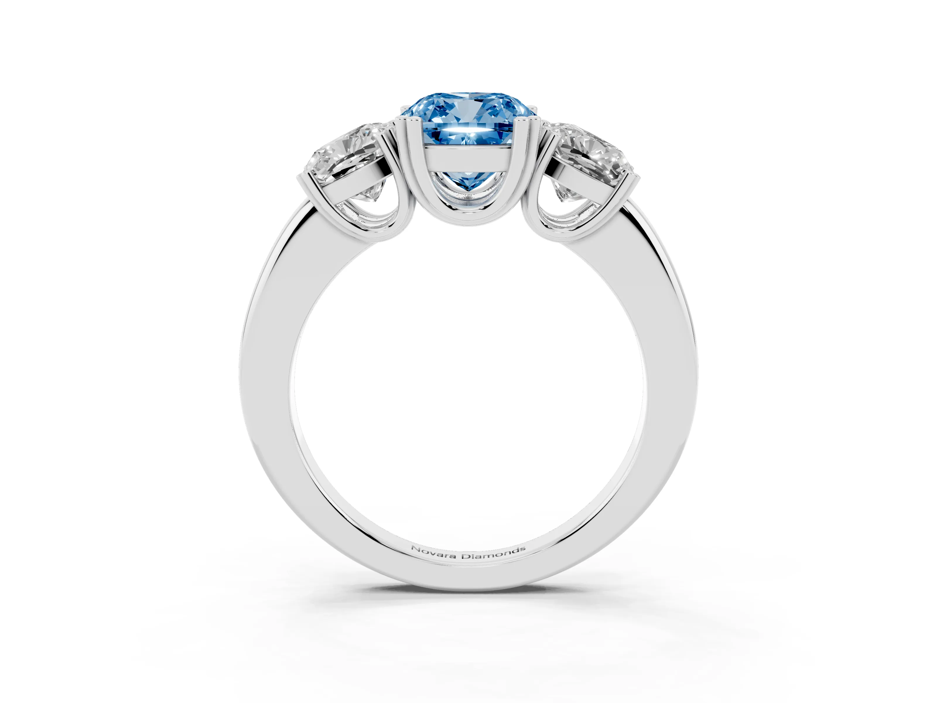 Fancy Blue Cushion Cut Diamond Three-Stone Ring Set in White gold with Polished Band and Prong Setting