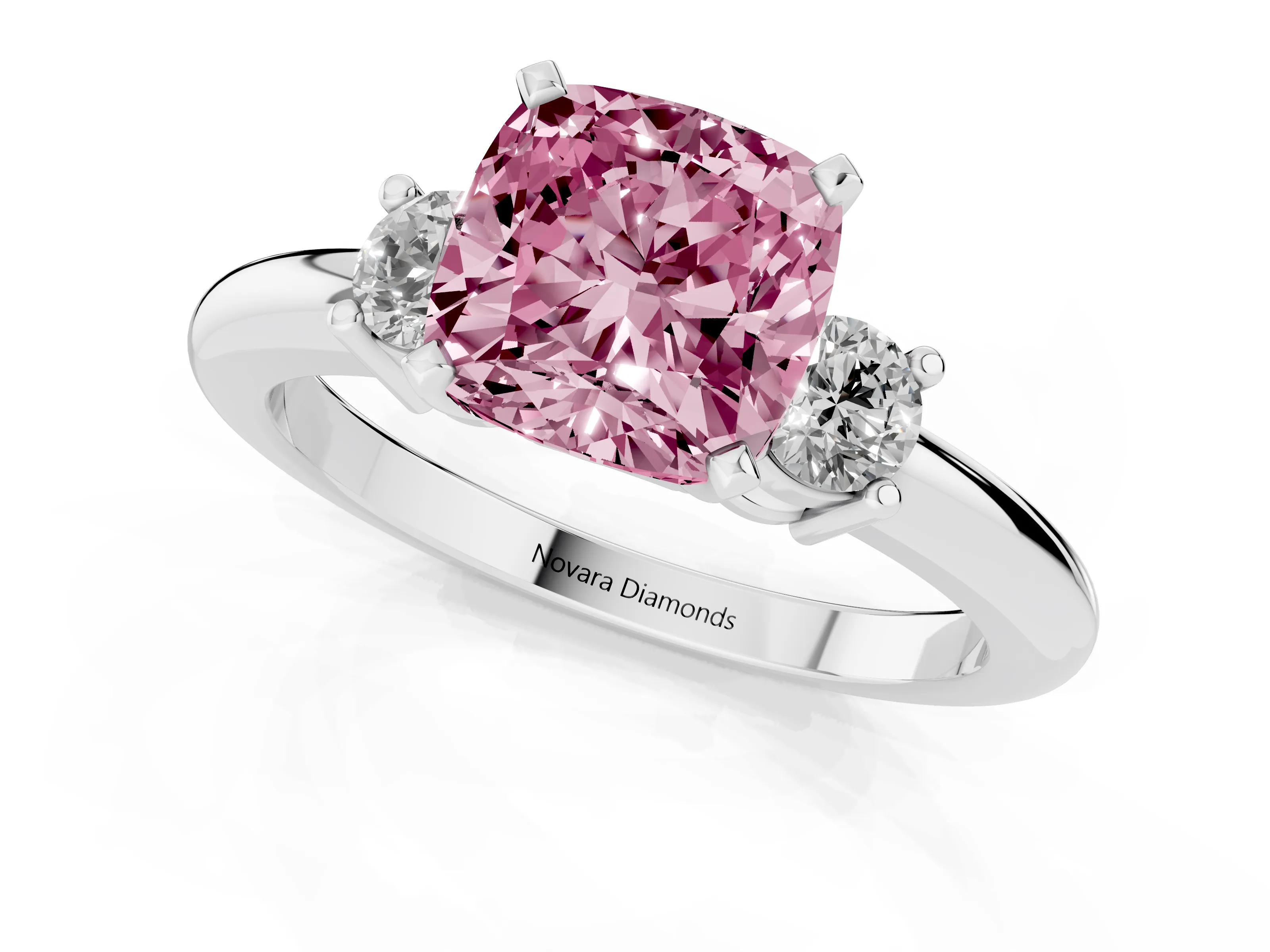 Fancy Pink Three-Stone Cushion Cut Diamond Ring Set in Platinum with Prong Setting and Plain Band
