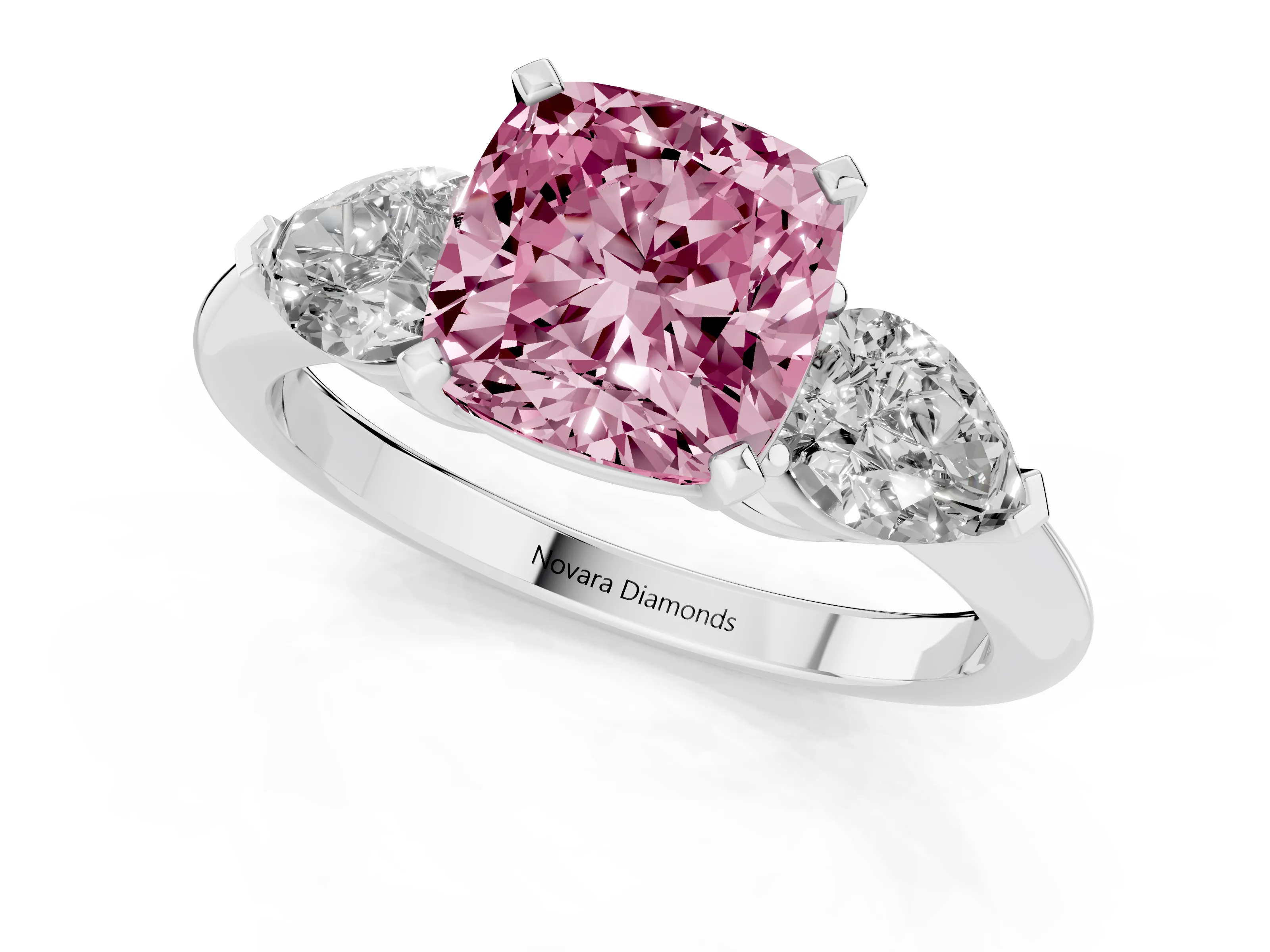 Fancy Pink Three-Stone Cushion Cut Diamond Ring Set in Platinum with Pear Side Stones and Prong Setting