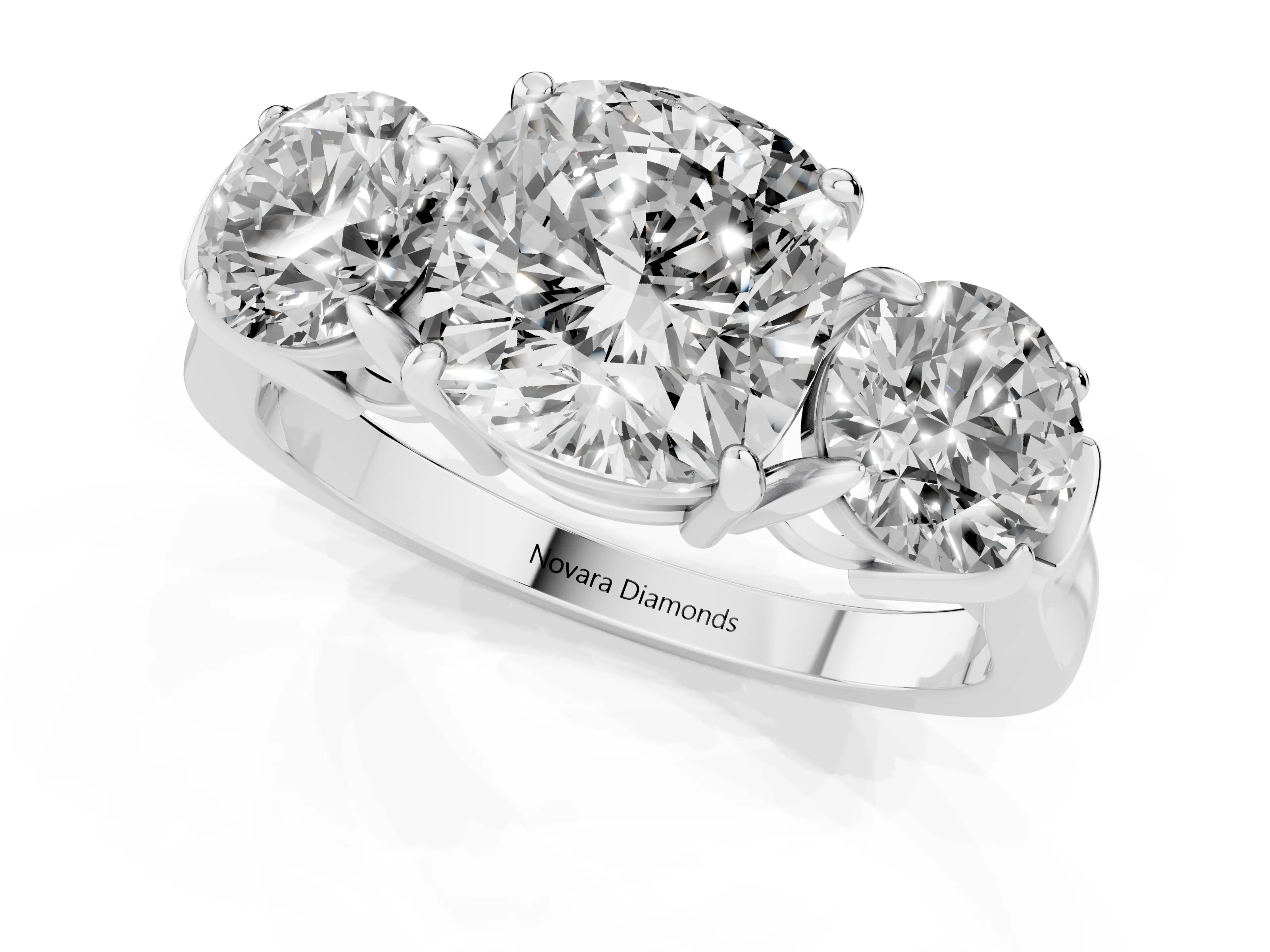 Cushion Cut Diamond Three-Stone Ring Set in Platinum with Round Accent Stones and Plain Band