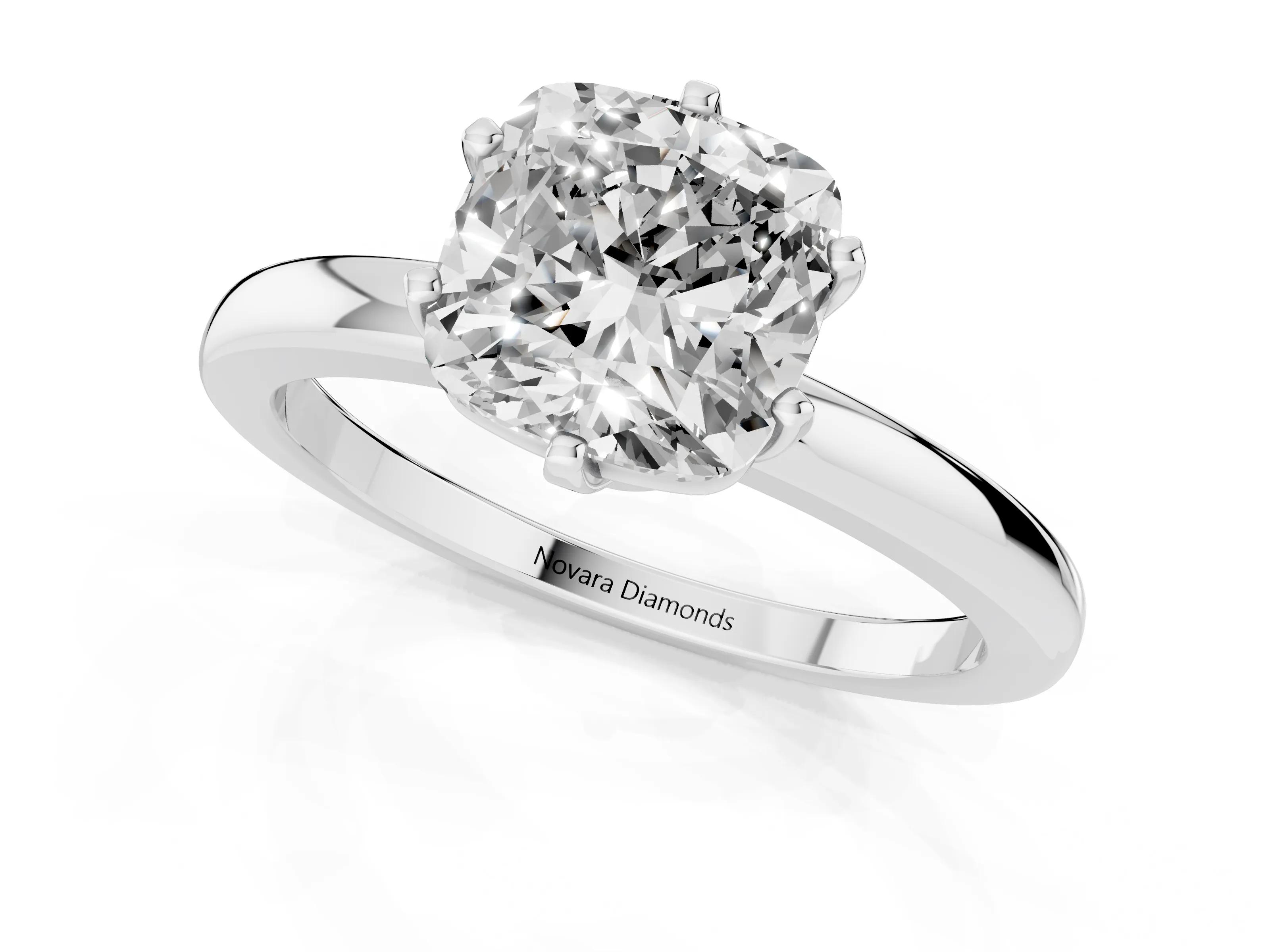 Cushion Cut Diamond Solitaire Ring Set in White gold with Raised Prong Setting on a Classic Band