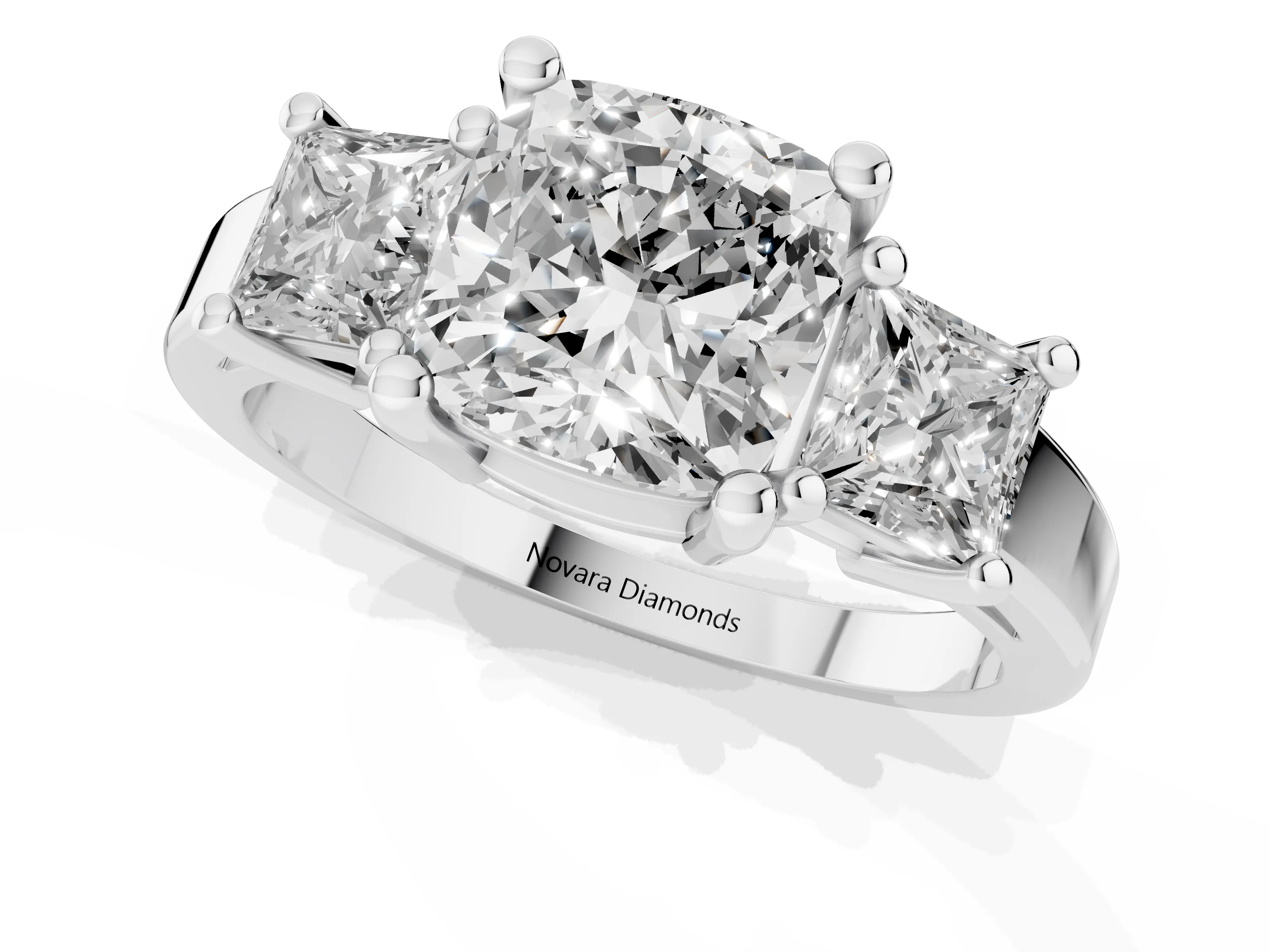 Three-Stone Cushion Cut Diamond Solitaire Ring Set in Platinum with Prong Setting