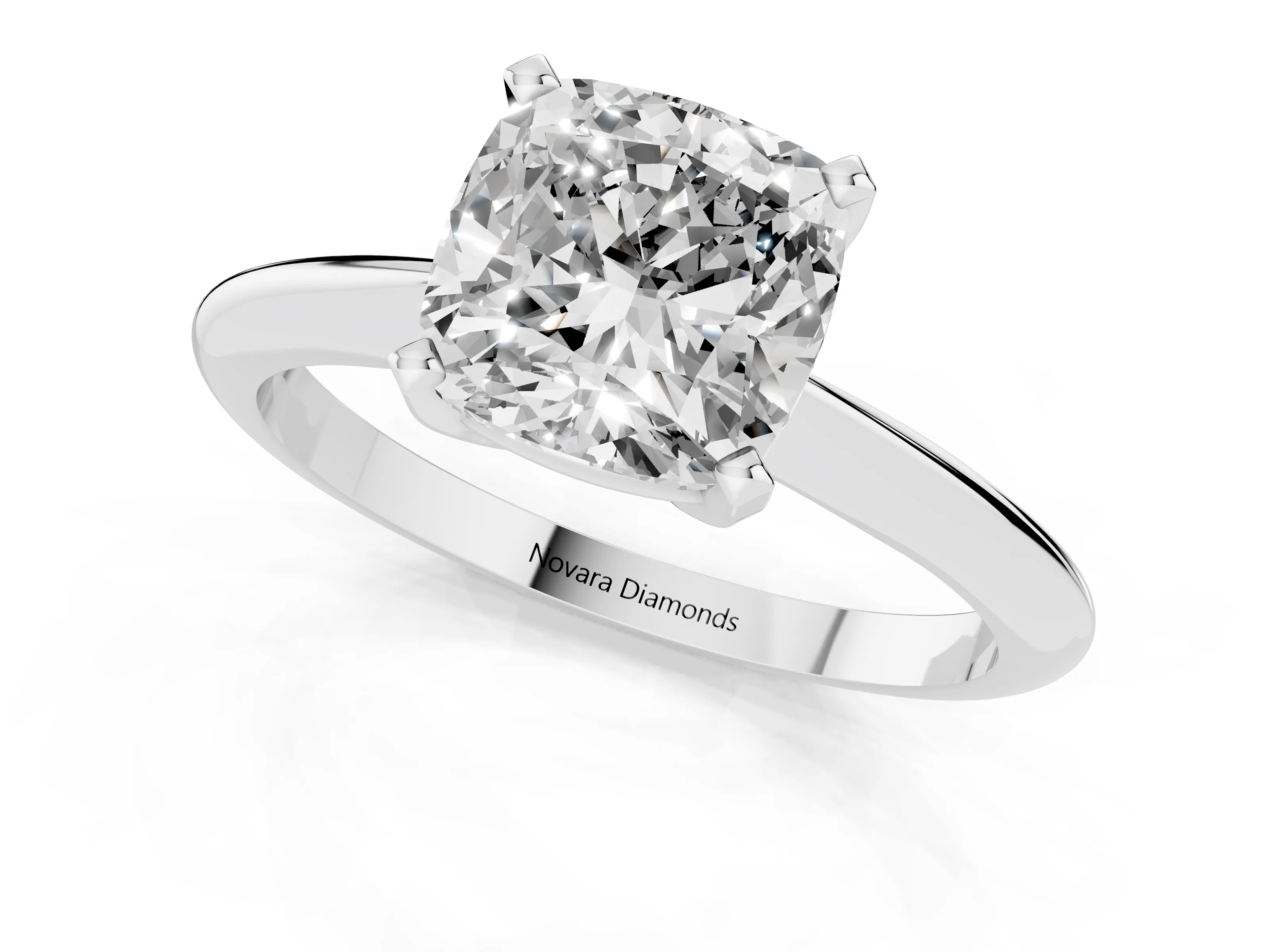 Cushion Cut Diamond Solitaire Ring Set in Platinum with Prong Setting on a Plain Round Band
