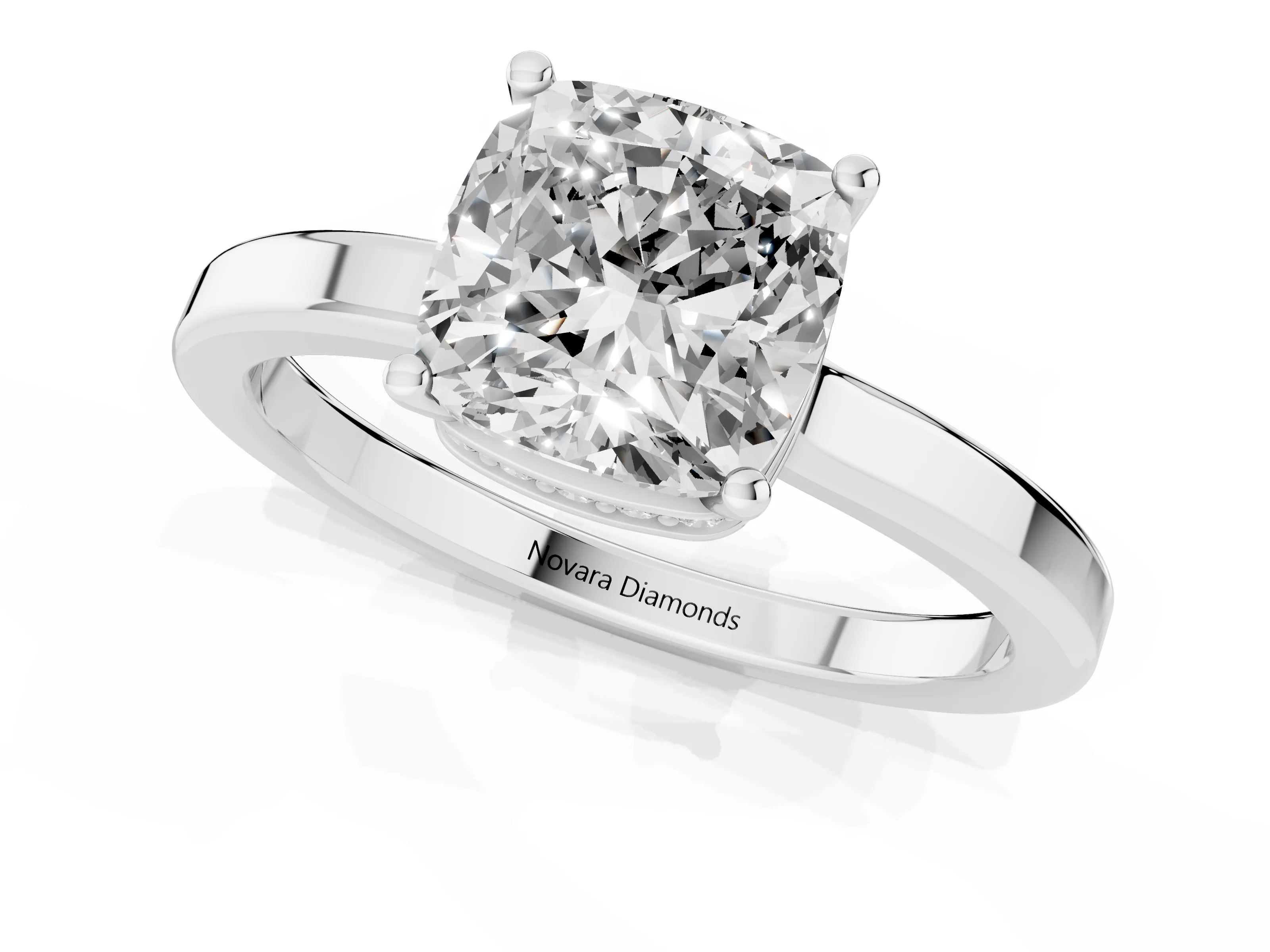 Cushion Cut Diamond Solitaire Engagement Ring Set in White gold with Prong Setting on a Plain Band