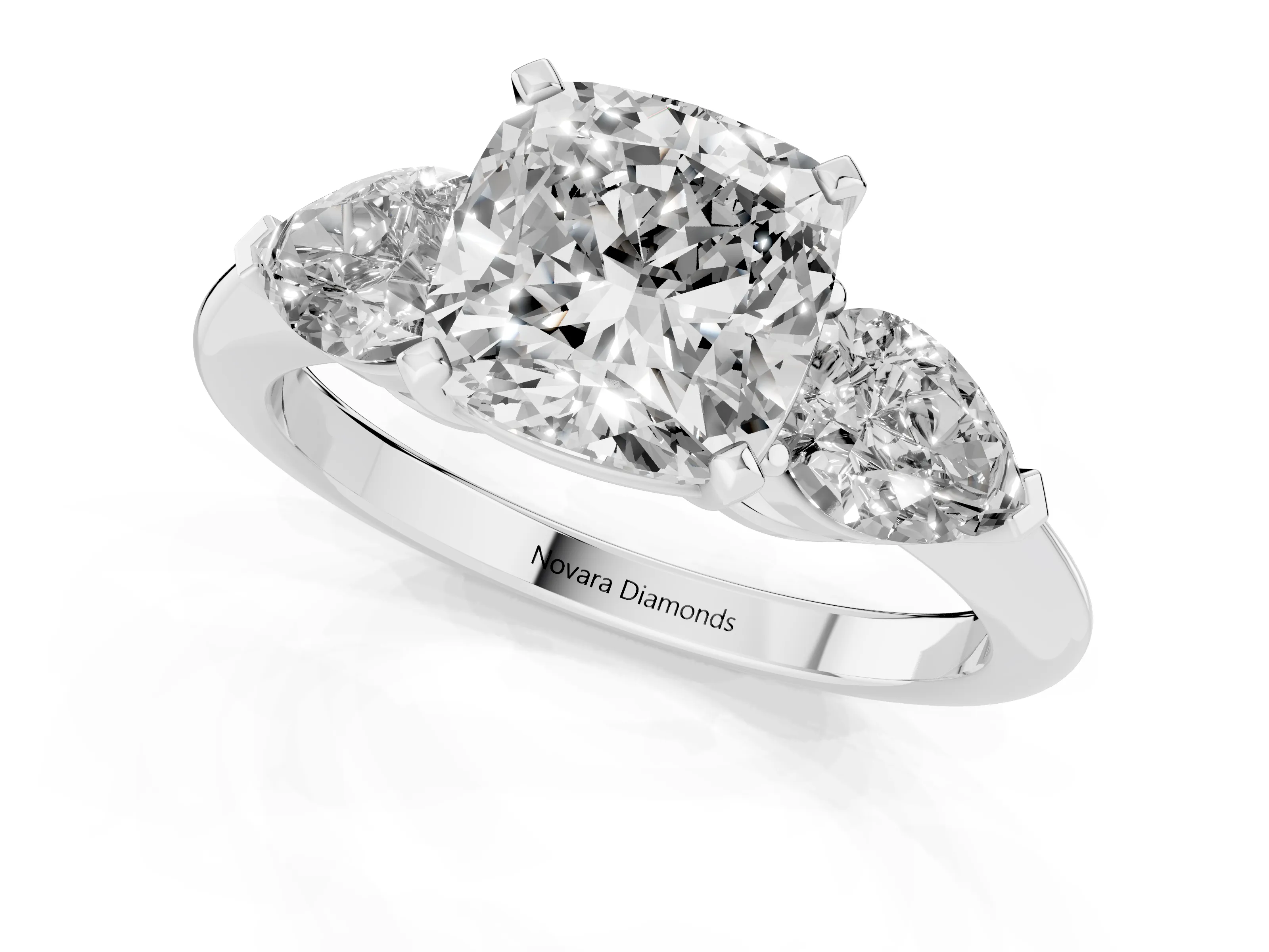 Three-Stone Cushion Cut Diamond Ring Set in Silver with Pear Side Stones and Prong Setting