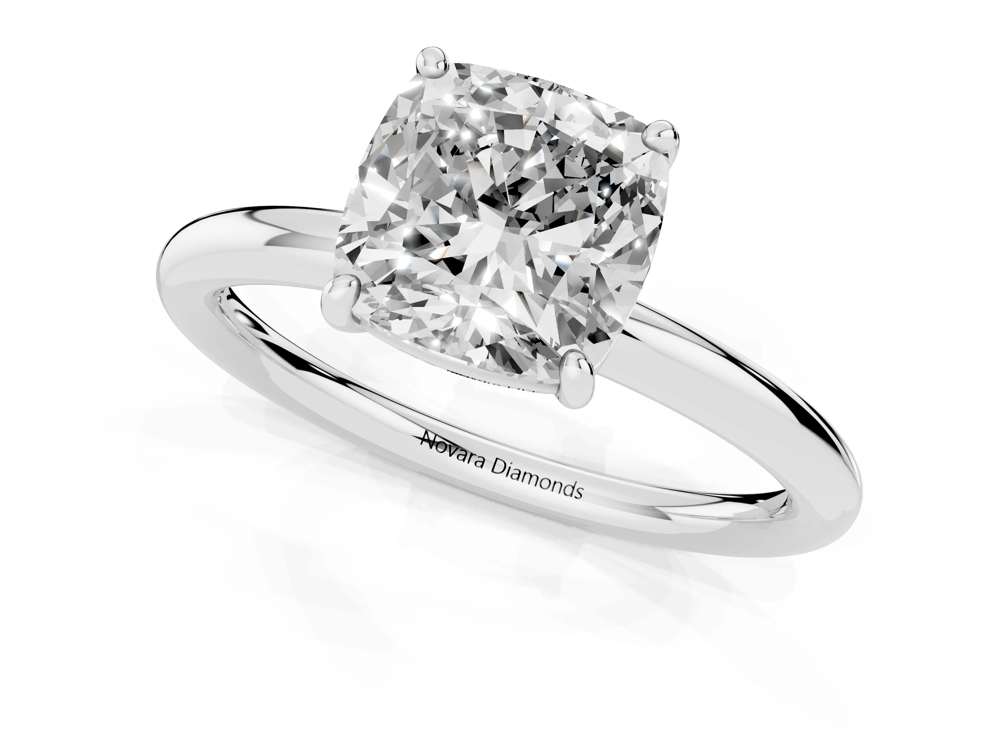 Cushion Cut Diamond Solitaire Ring Set in White gold with Prong Setting on a Polished Plain Band