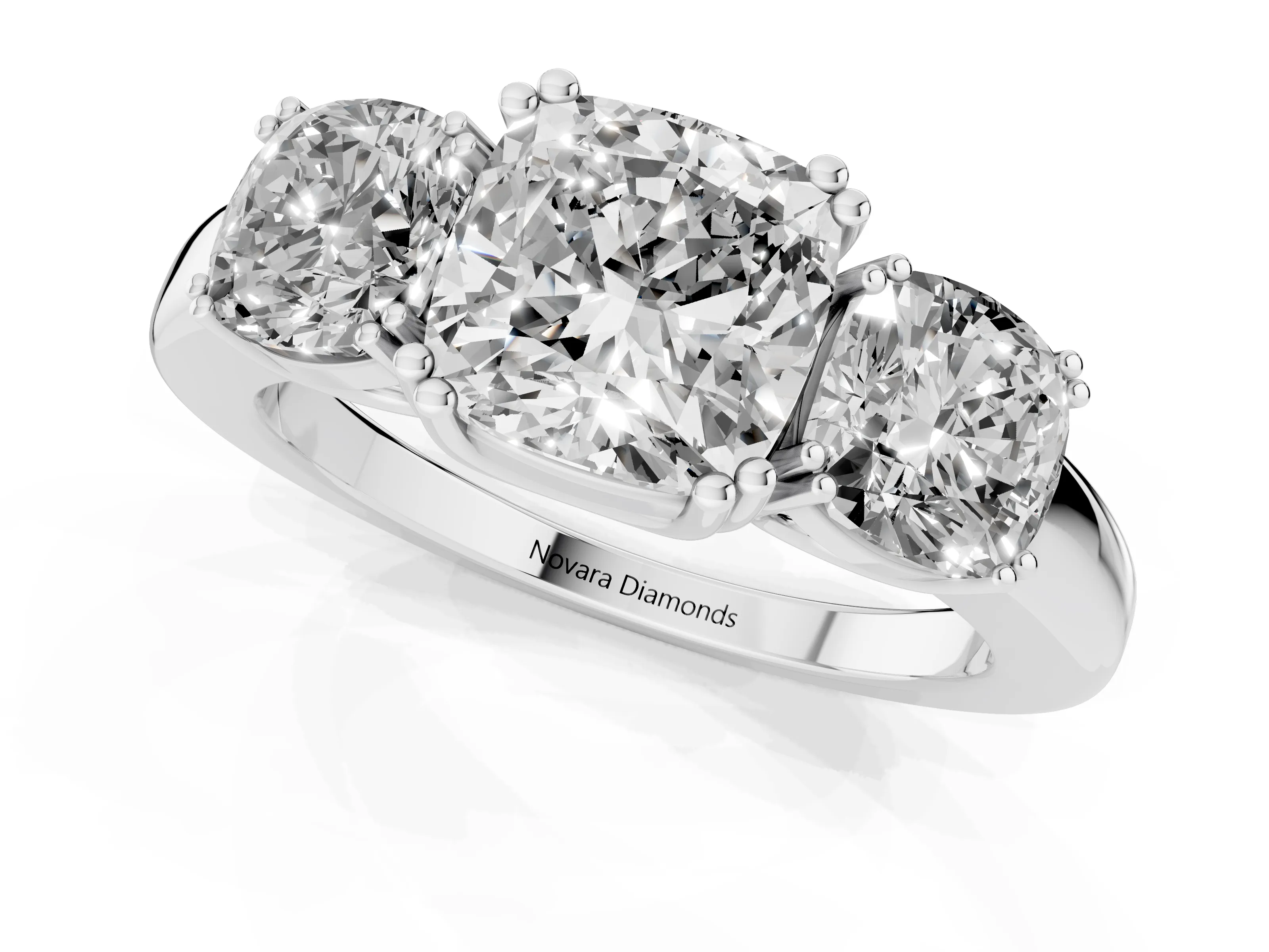 Cushion Cut Diamond Three-Stone Ring Set in Platinum with Polished Band and Prong Setting