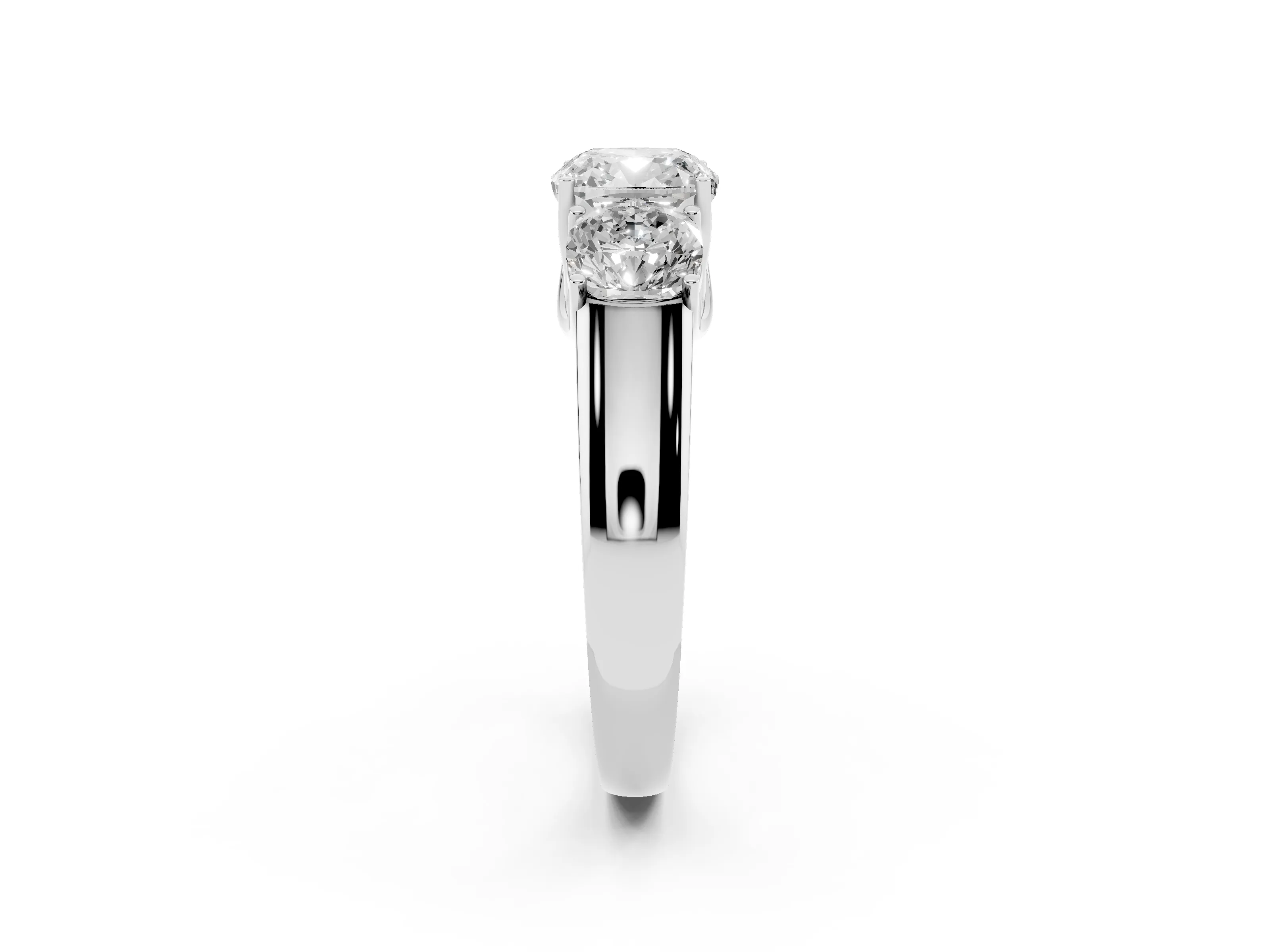 Three-Stone Cushion Cut Diamond Ring Set in Platinum with Matching Prong Settings and Plain Band