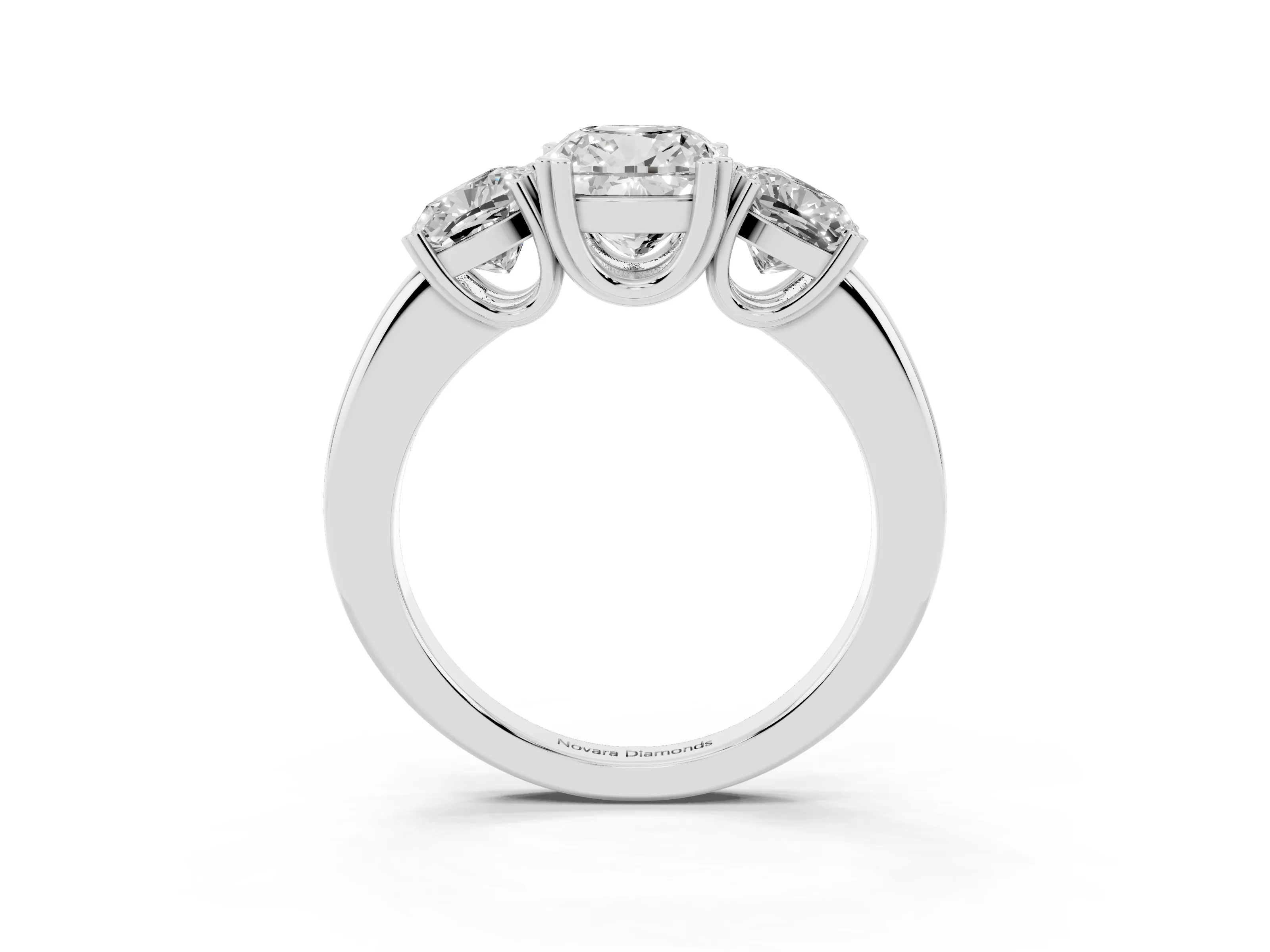 Cushion Cut Diamond Three-Stone Ring Set in Platinum with Polished Band and Prong Setting
