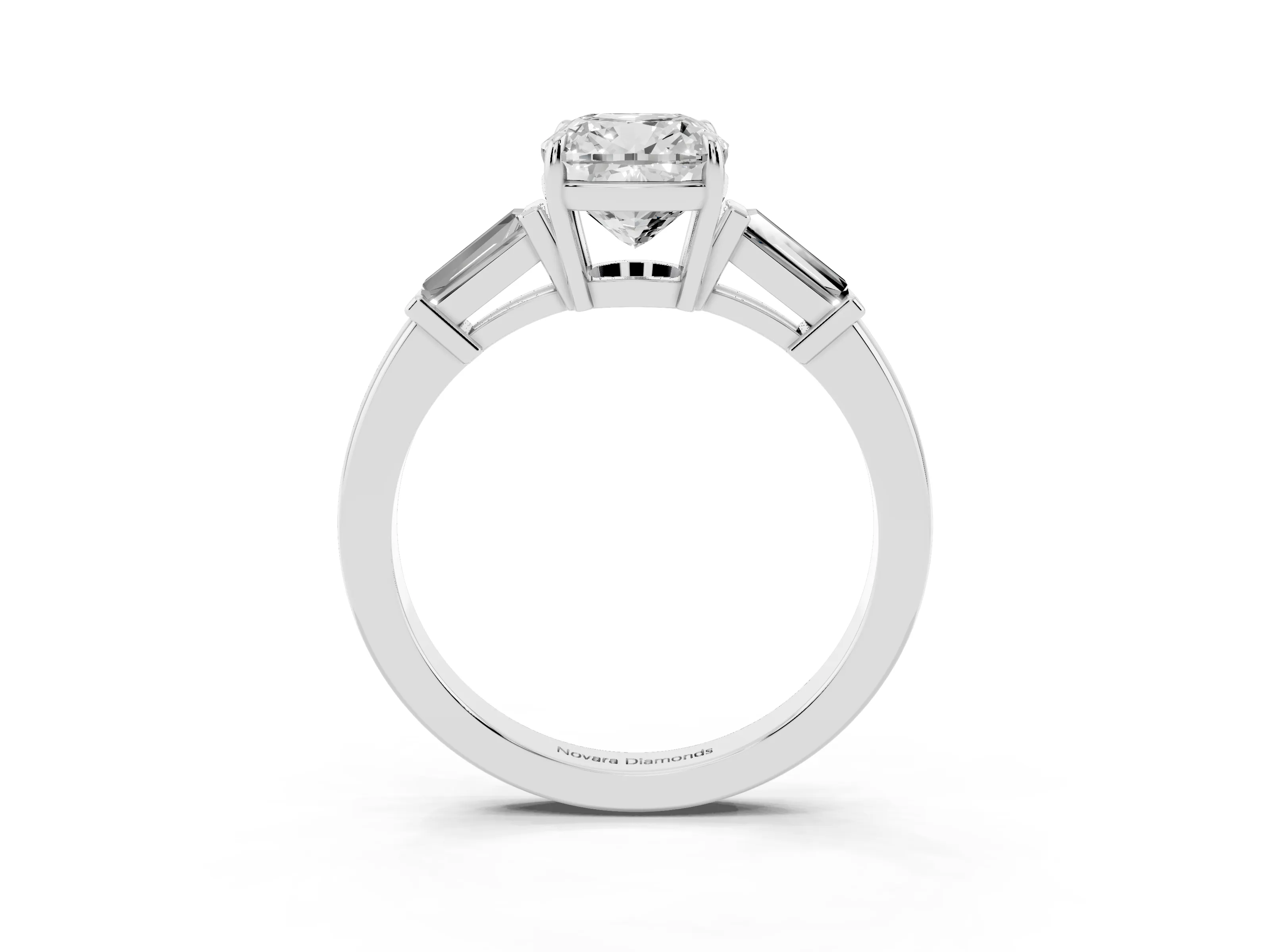 Cushion Cut Diamond Three-Stone Ring Set in Platinum with Tapered Baguette Side Stones and Prong Setting