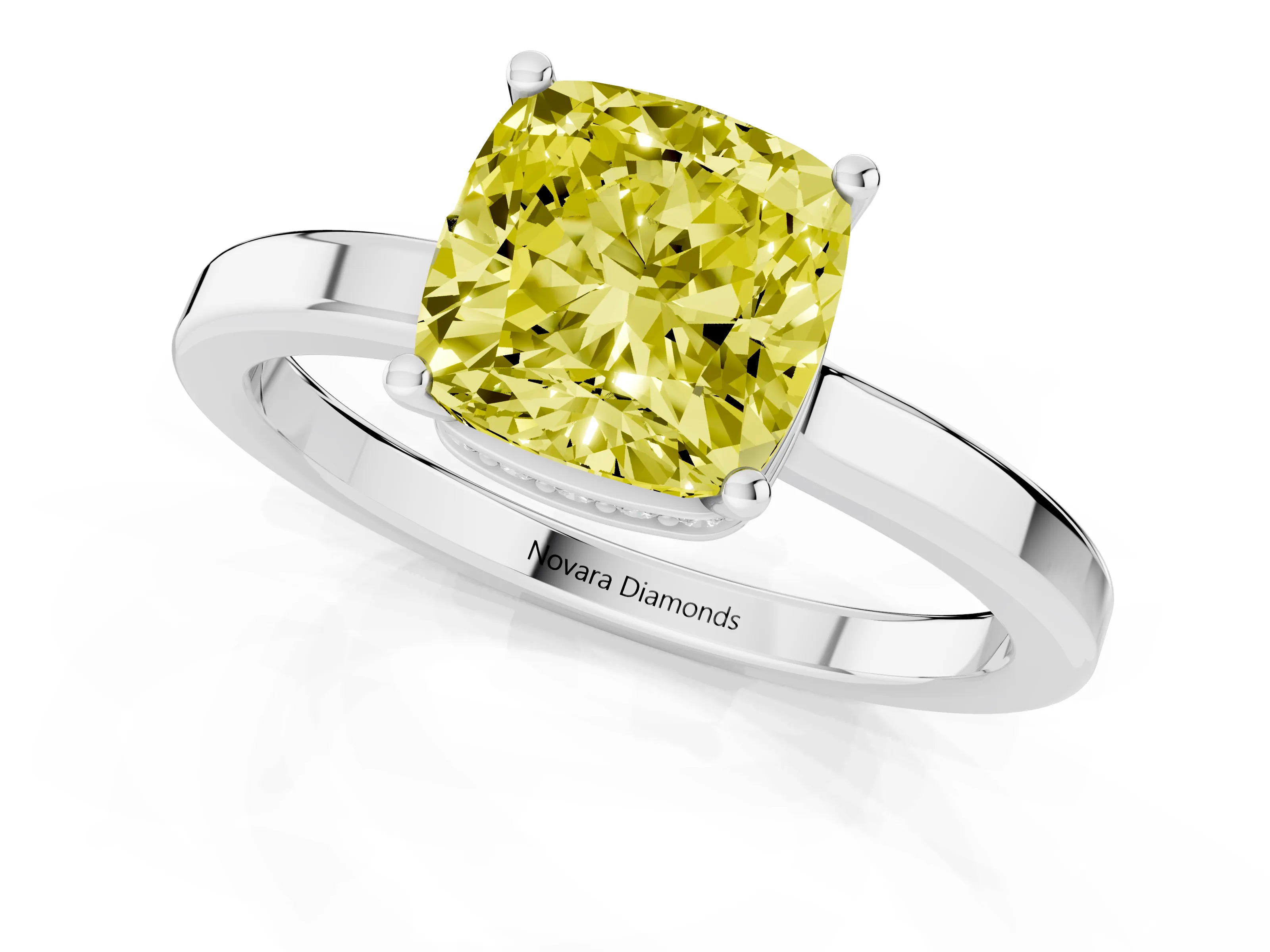 Fancy Yellow Cushion Cut Diamond Solitaire Engagement Ring Set in White gold with Prong Setting on a Plain Band