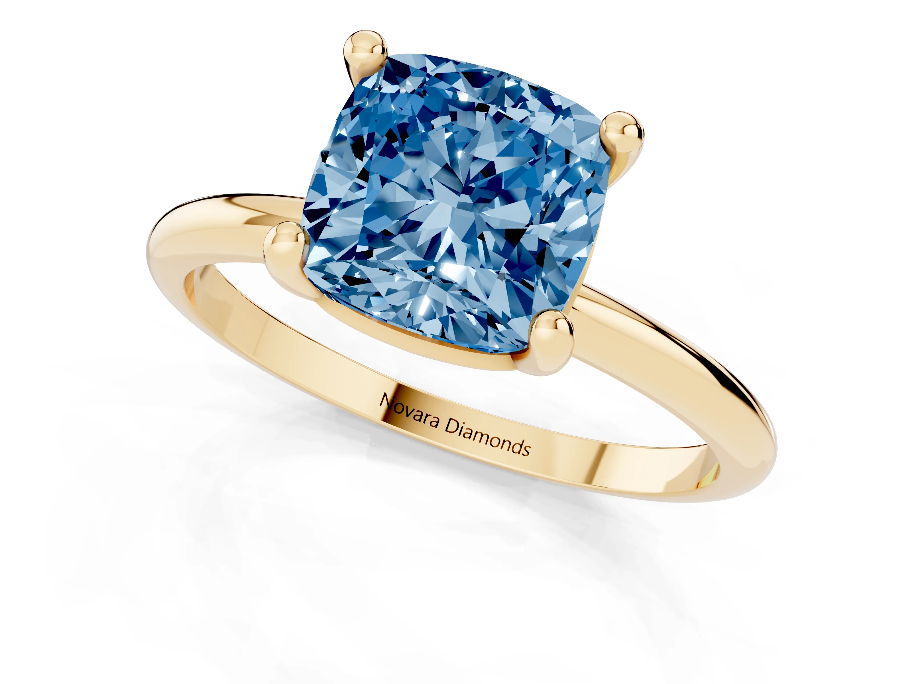 Fancy Blue Cushion Cut Diamond Solitaire Ring Set in Yellow gold with Secure Prong Setting on a Classic Band