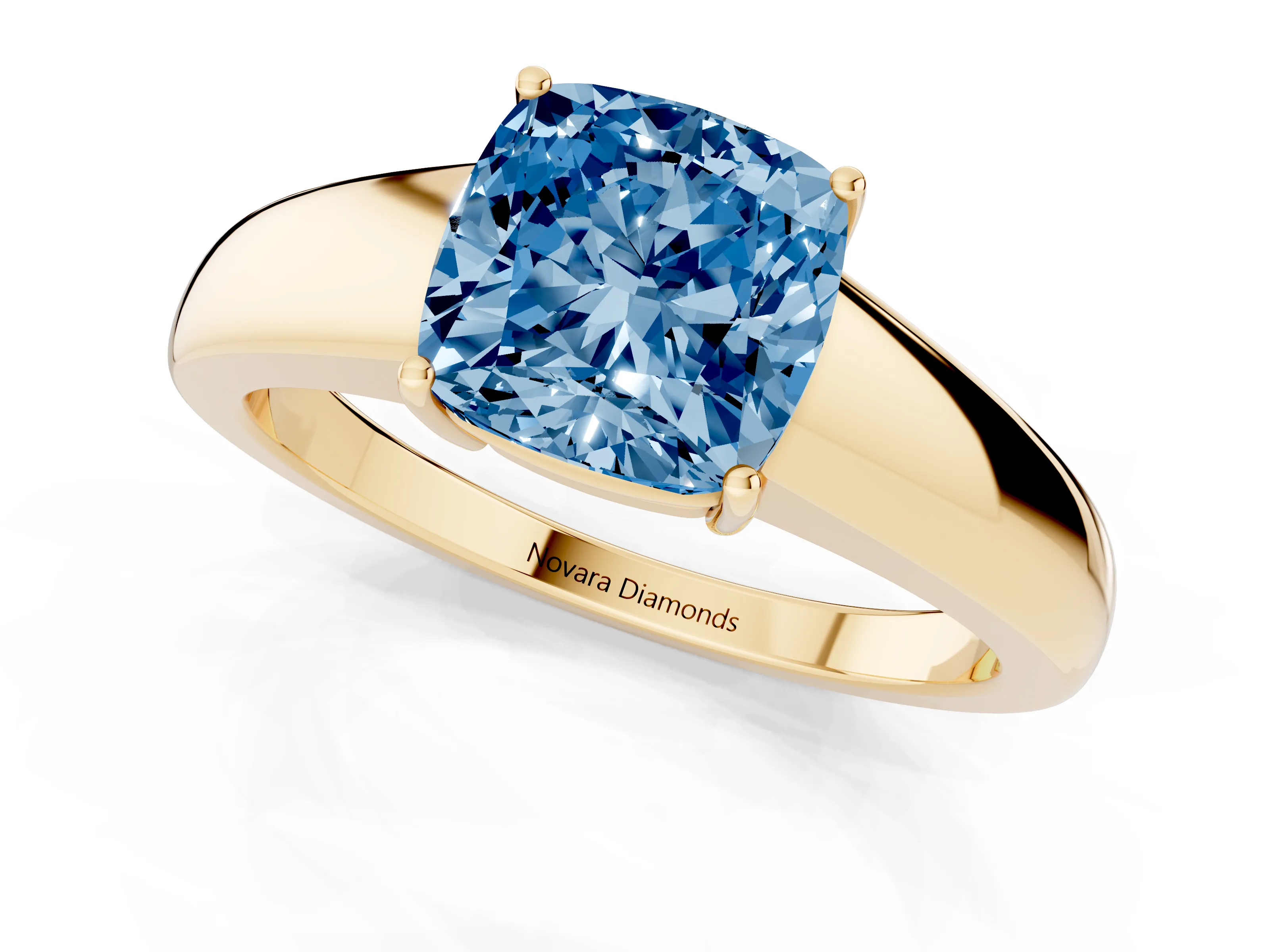 Fancy Blue Cushion Cut Diamond Solitaire Ring Set in Yellow gold with Tapered Band and Prong Setting