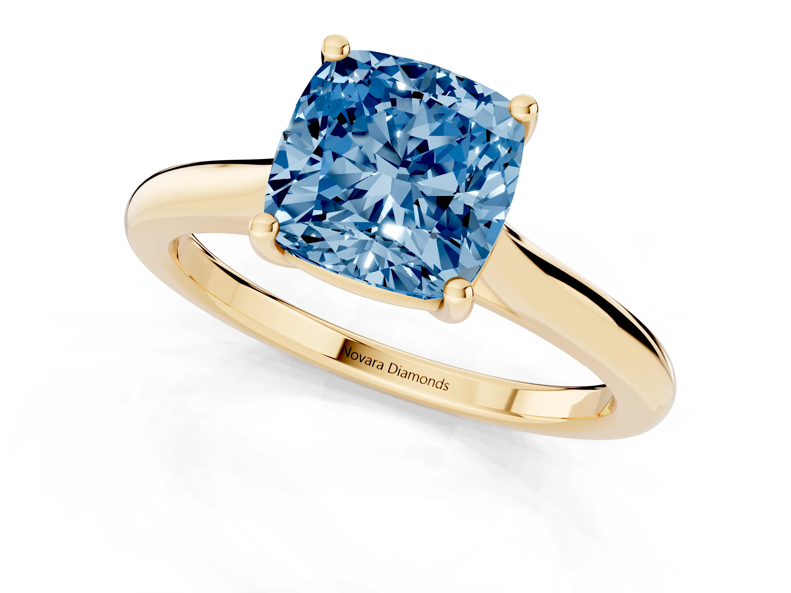 Fancy Blue Cushion Cut Diamond Solitaire Ring Set in Yellow gold with Cathedral Band and Prong Setting
