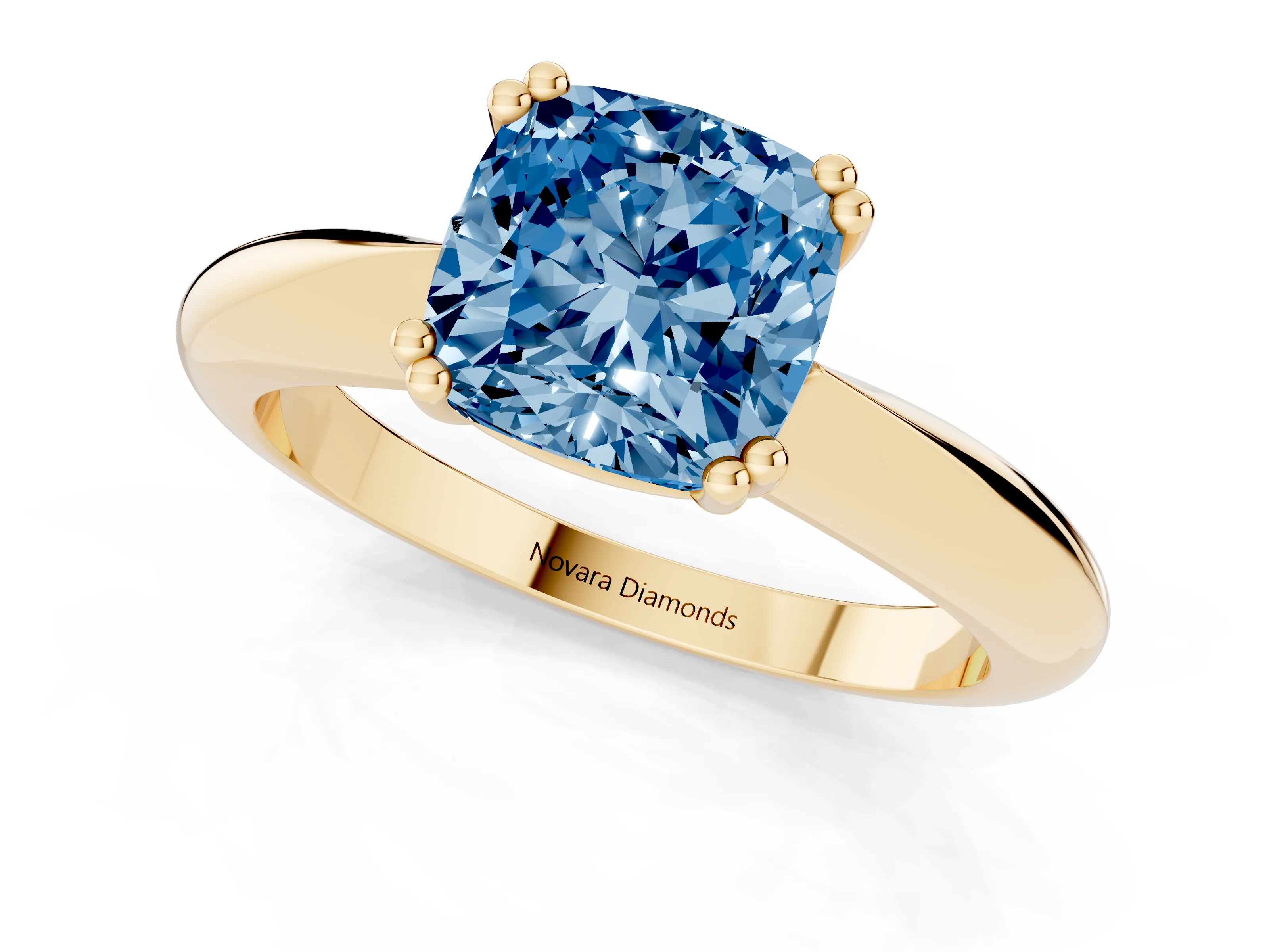 Fancy Blue Cushion Cut Diamond Solitaire Engagement Ring Set in Yellow gold with Tapered Band and Prong Setting
