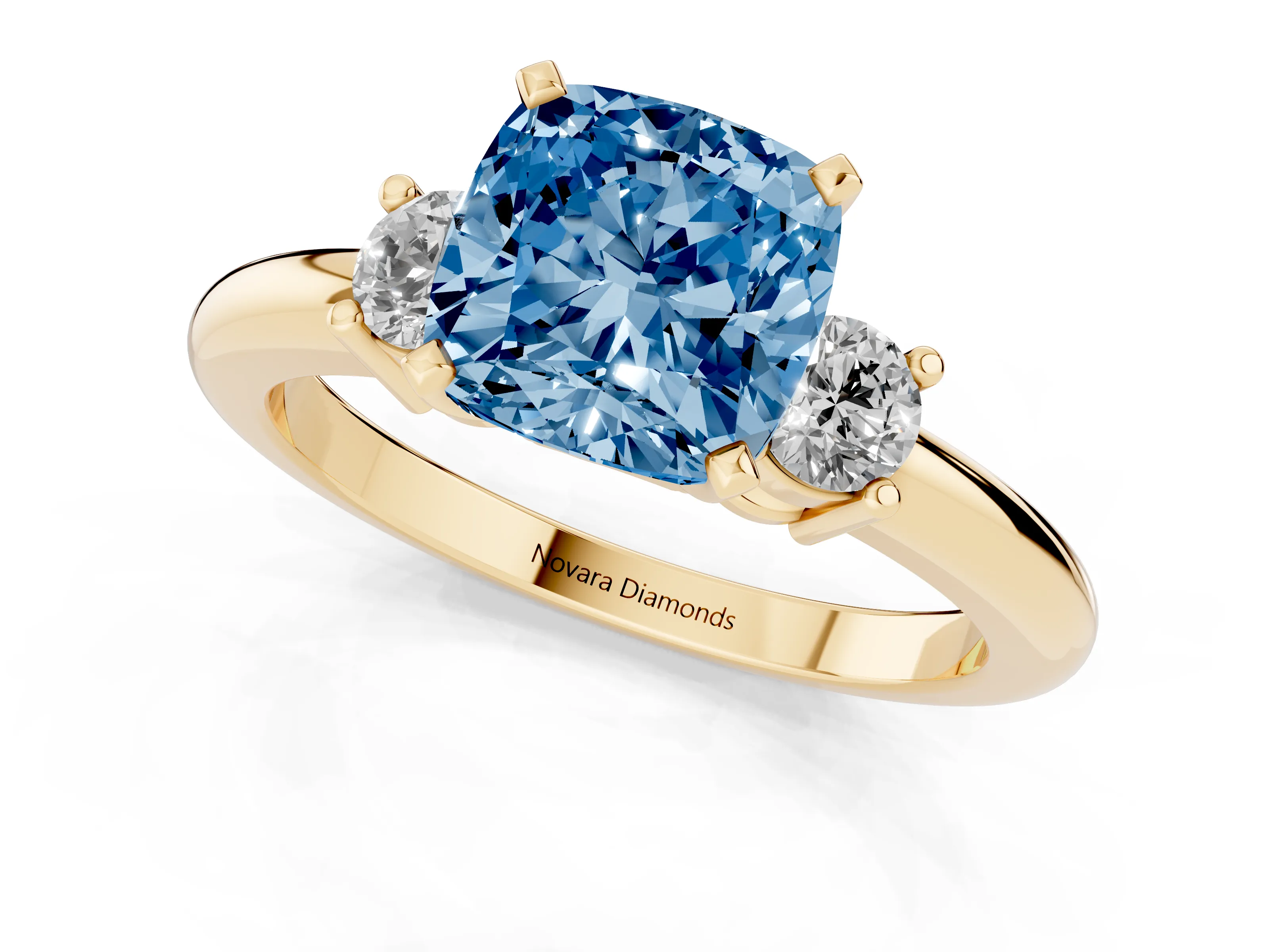 Fancy Blue Three-Stone Cushion Cut Diamond Ring Set in Yellow gold with Prong Setting and Plain Band