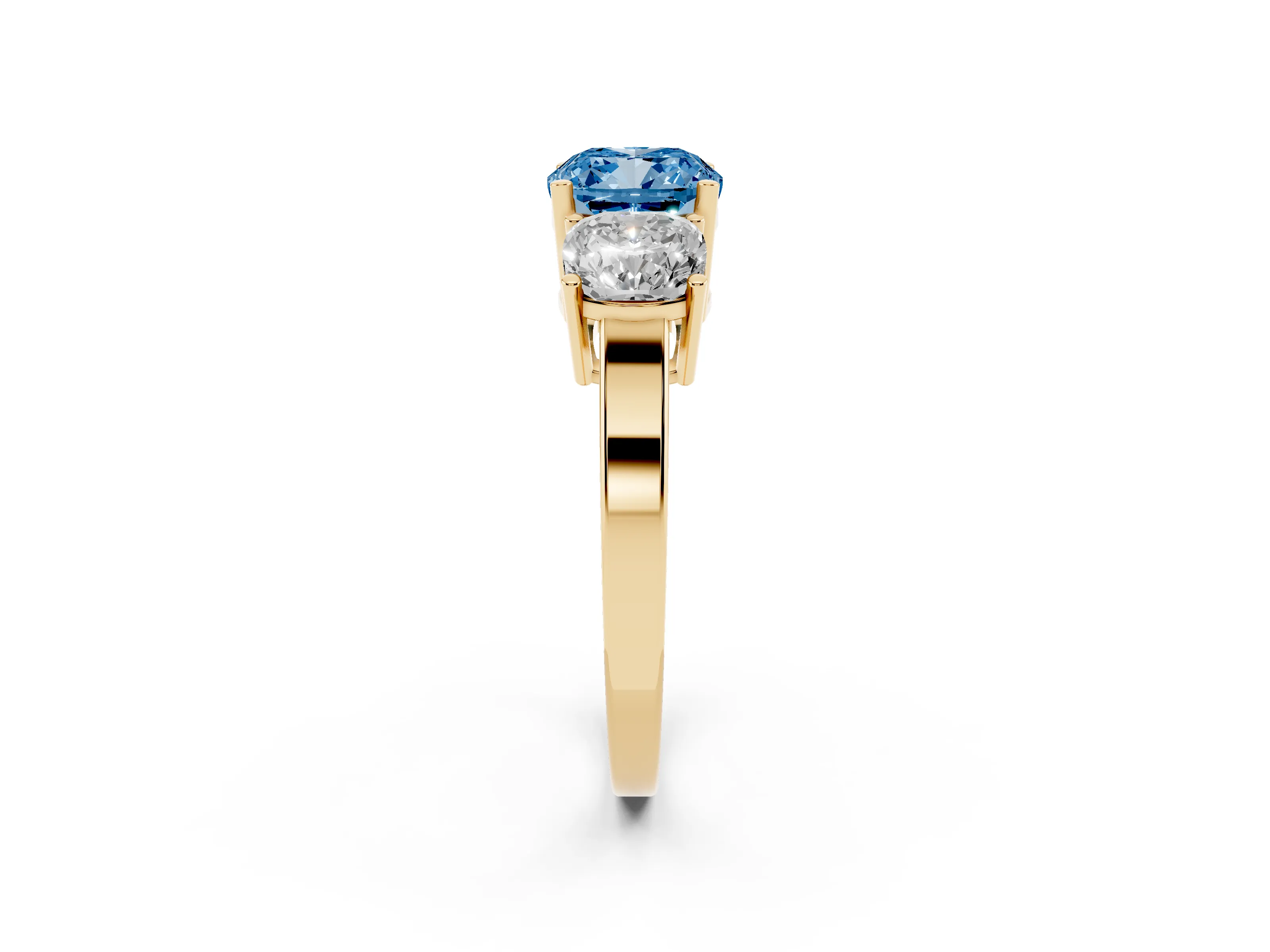 Fancy Blue Cushion Cut Diamond Three-Stone Engagement Ring Set in Yellow gold with Flat Band
