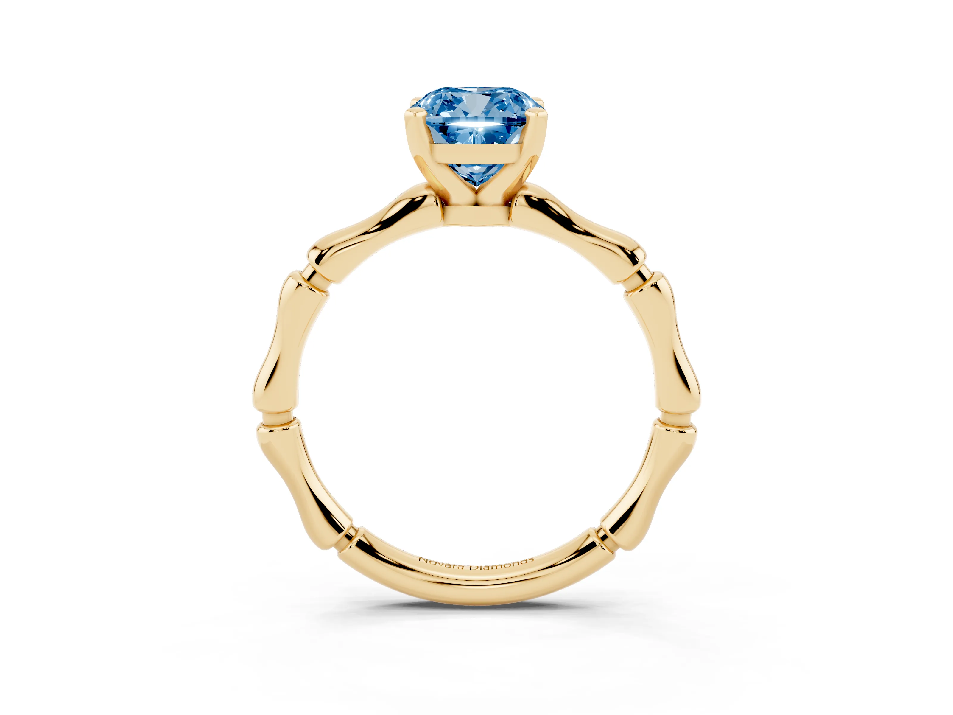 Fancy Blue Cushion Cut Diamond Solitaire Ring Set in Yellow gold with Bamboo Band and Prong Setting