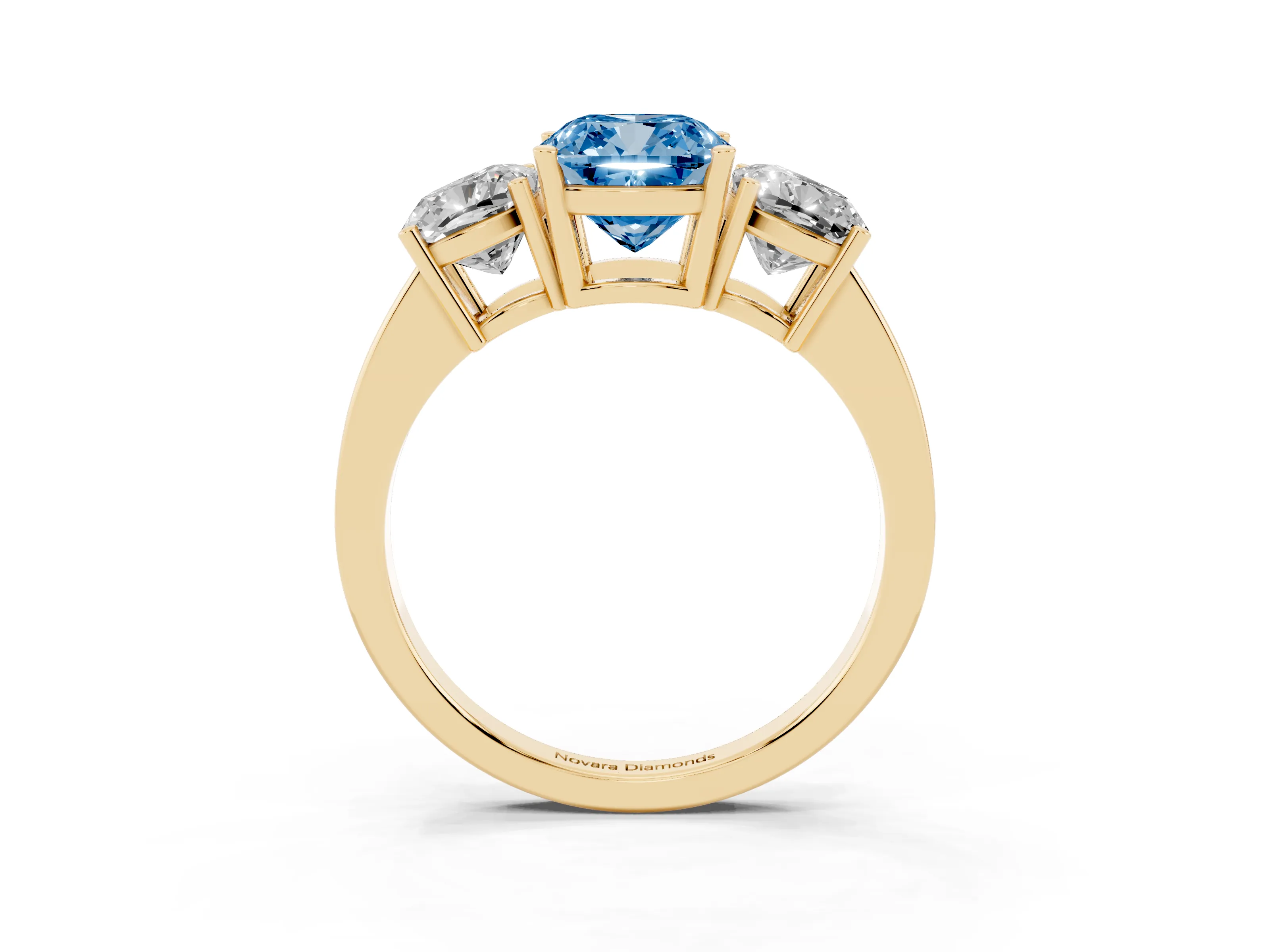 Fancy Blue Cushion Cut Diamond Three-Stone Engagement Ring Set in Yellow gold with Flat Band