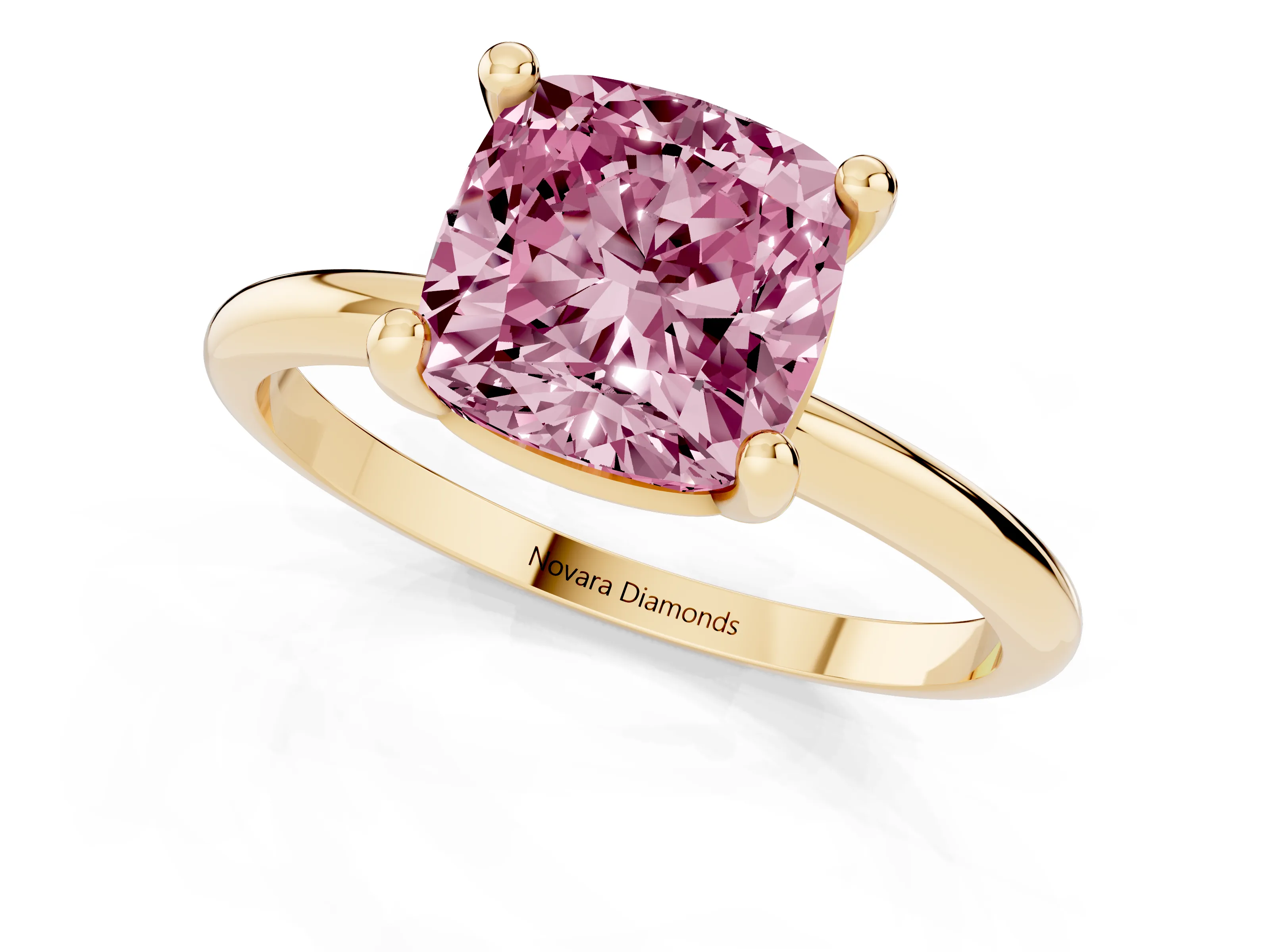 Fancy Pink Cushion Cut Diamond Solitaire Ring Set in Yellow gold with Secure Prong Setting on a Classic Band
