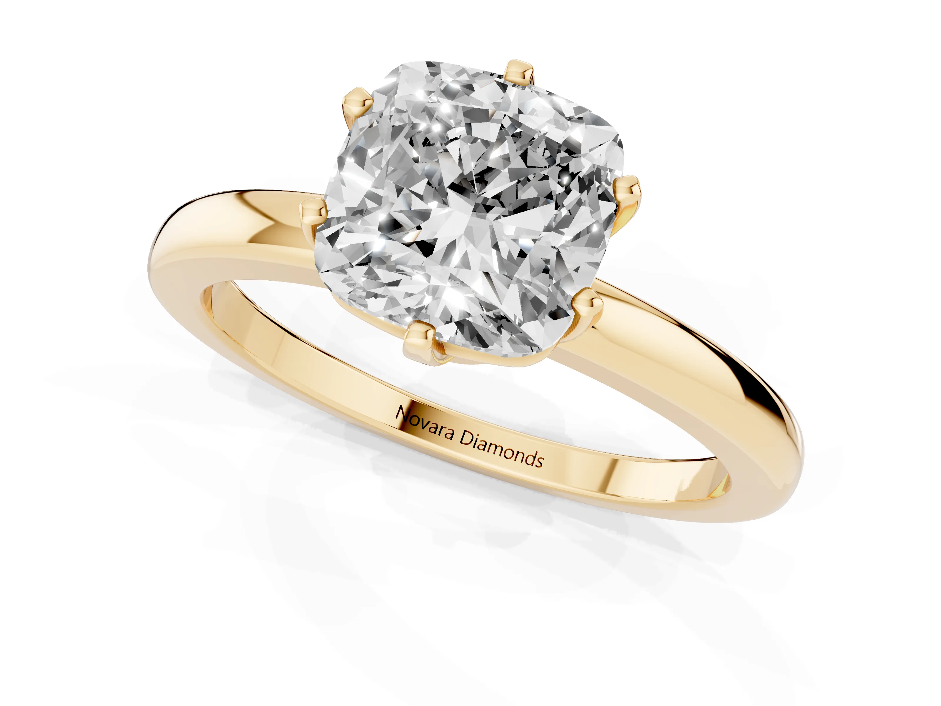 Cushion Cut Diamond Solitaire Ring Set in Yellow gold with Raised Prong Setting on a Classic Band
