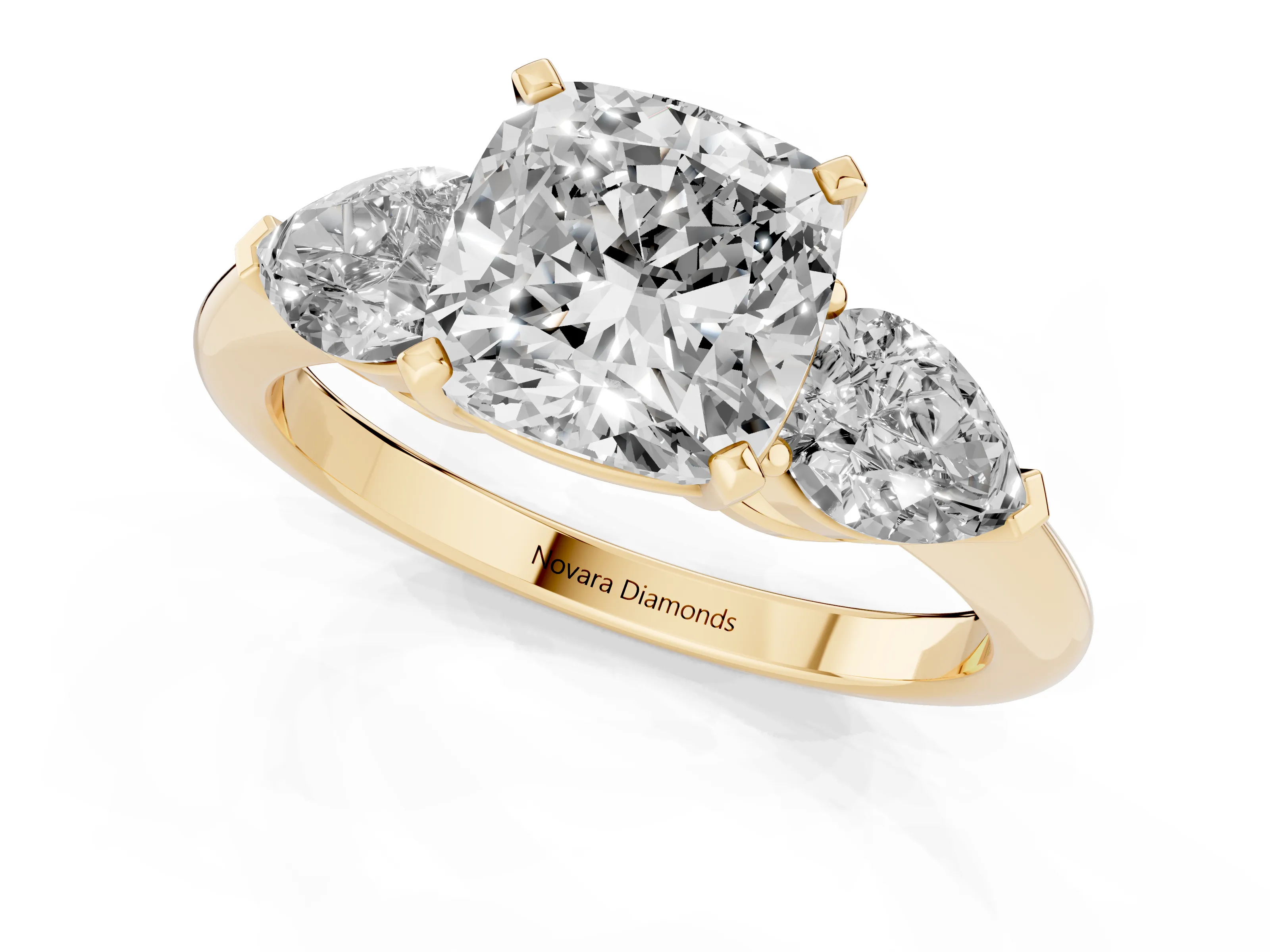 Three-Stone Cushion Cut Diamond Ring Set in Yellow gold with Pear Side Stones and Prong Setting