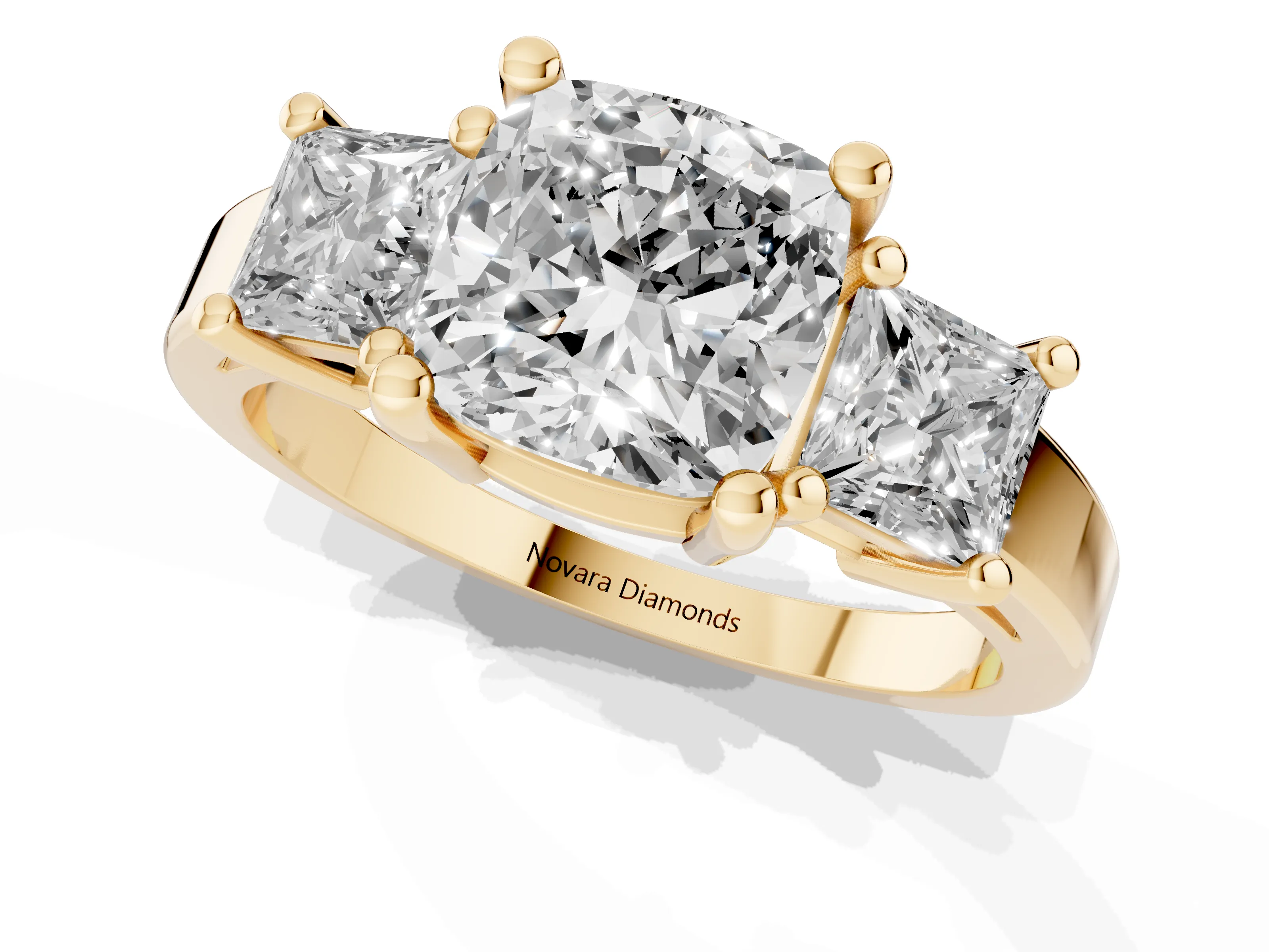 Three-Stone Cushion Cut Diamond Solitaire Ring Set in Yellow gold with Prong Setting