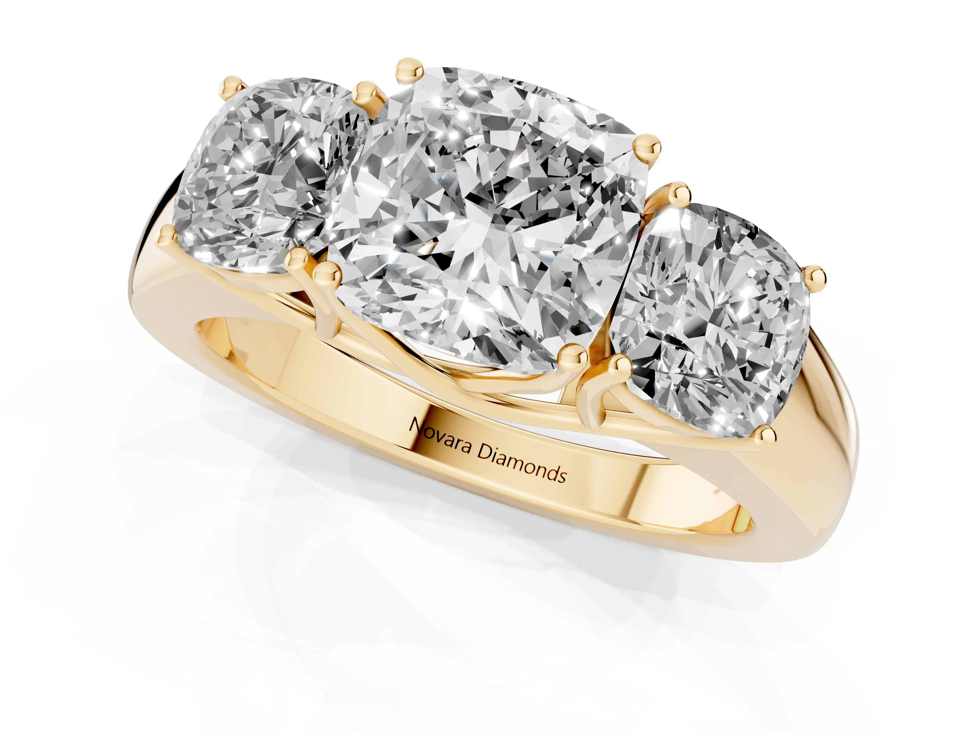 Three-Stone Cushion Cut Diamond Ring Set in Yellow gold with Matching Prong Settings and Plain Band