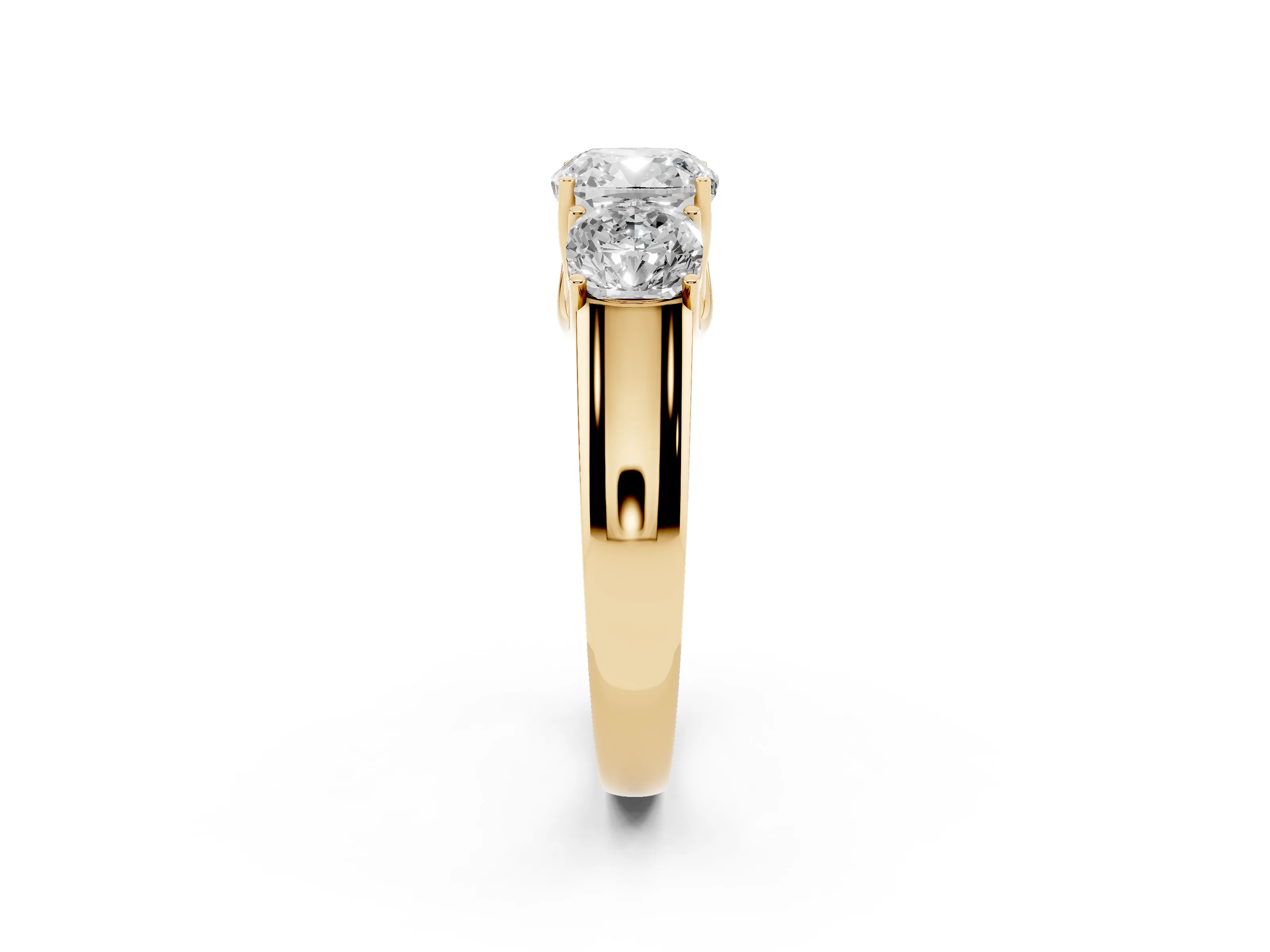 Three-Stone Cushion Cut Diamond Ring Set in Yellow gold with Matching Prong Settings and Plain Band