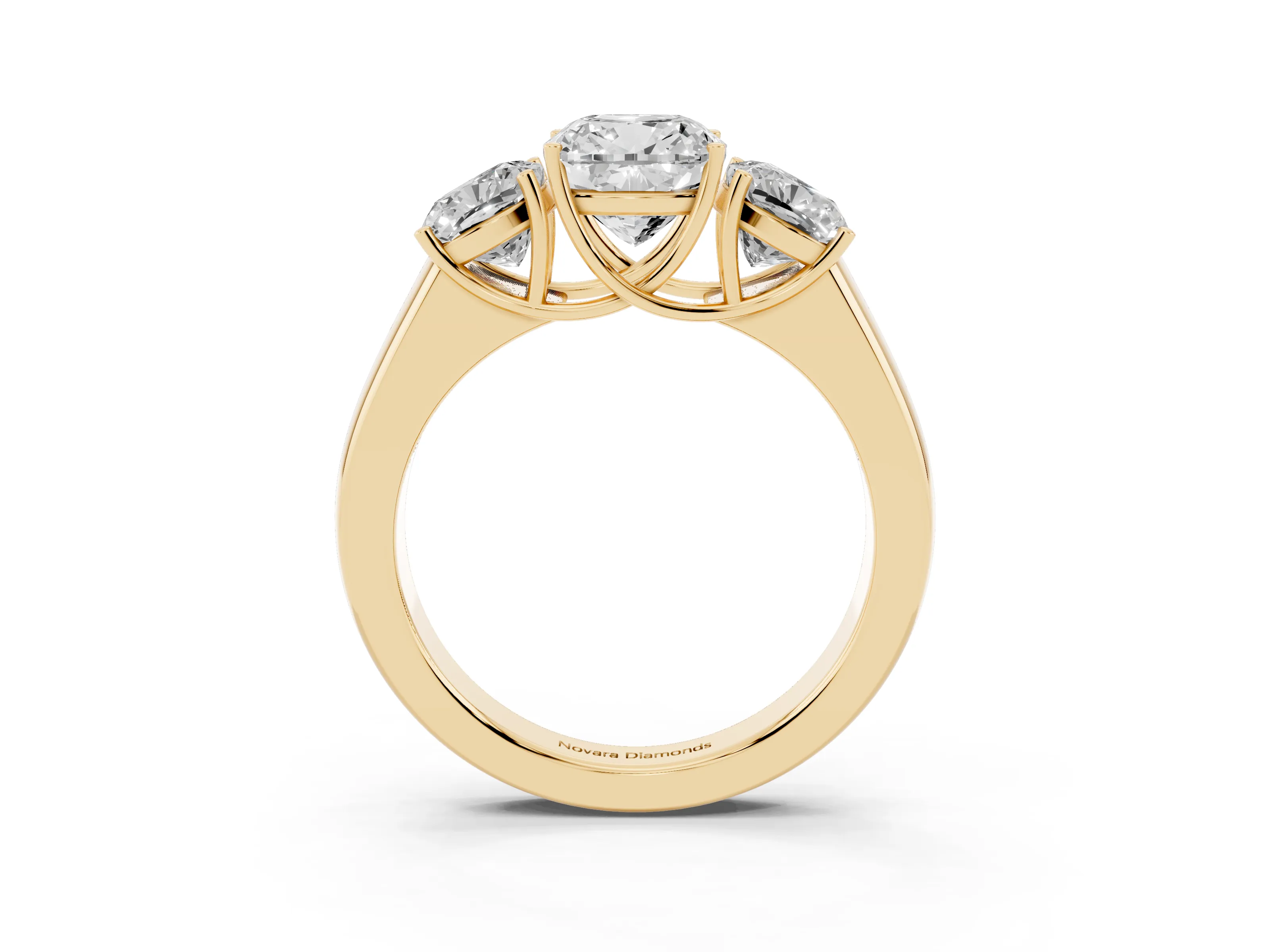 Three-Stone Cushion Cut Diamond Ring Set in Yellow gold with Matching Prong Settings and Plain Band