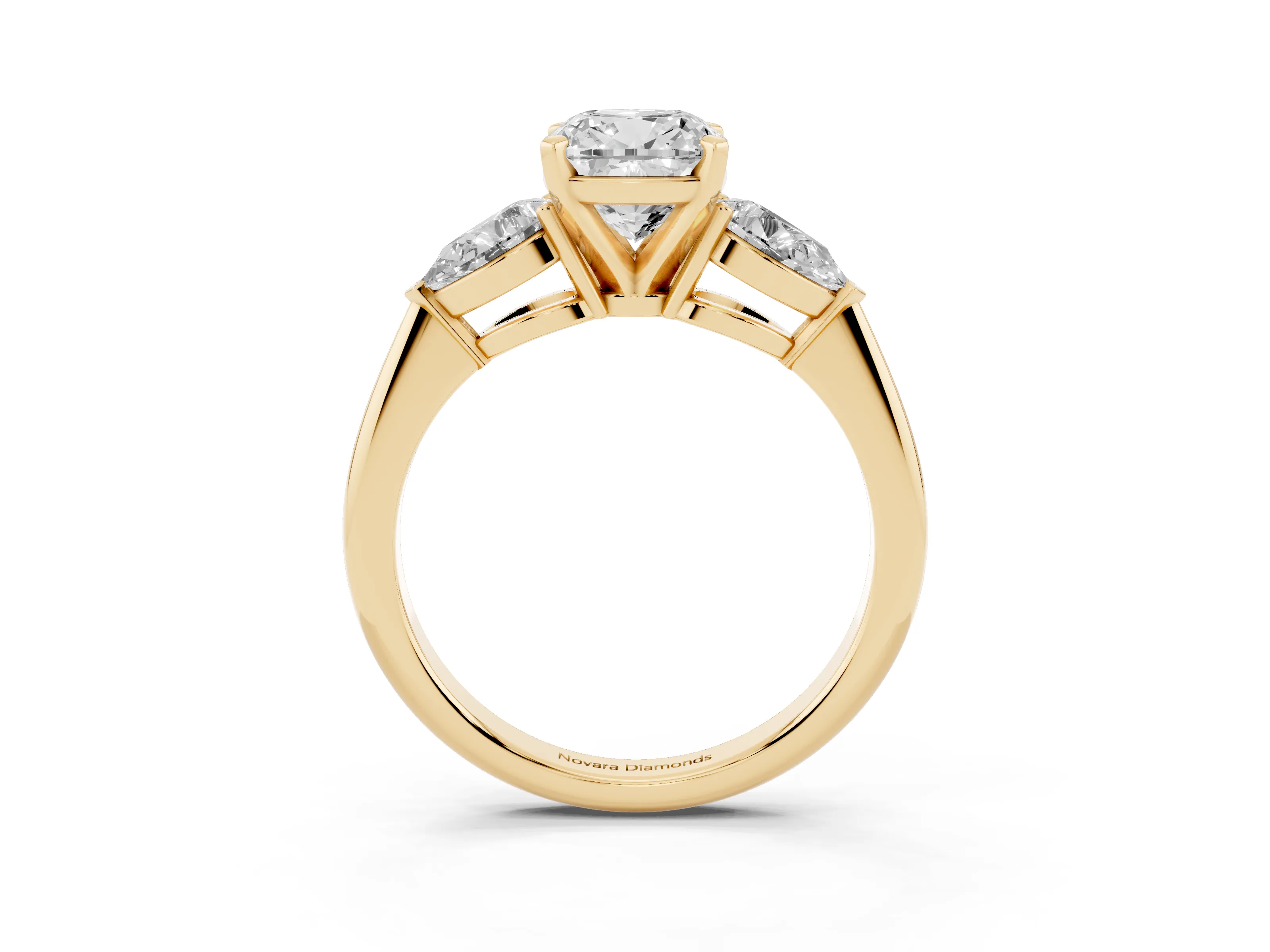 Three-Stone Cushion Cut Diamond Ring Set in Yellow gold with Pear Side Stones and Prong Setting