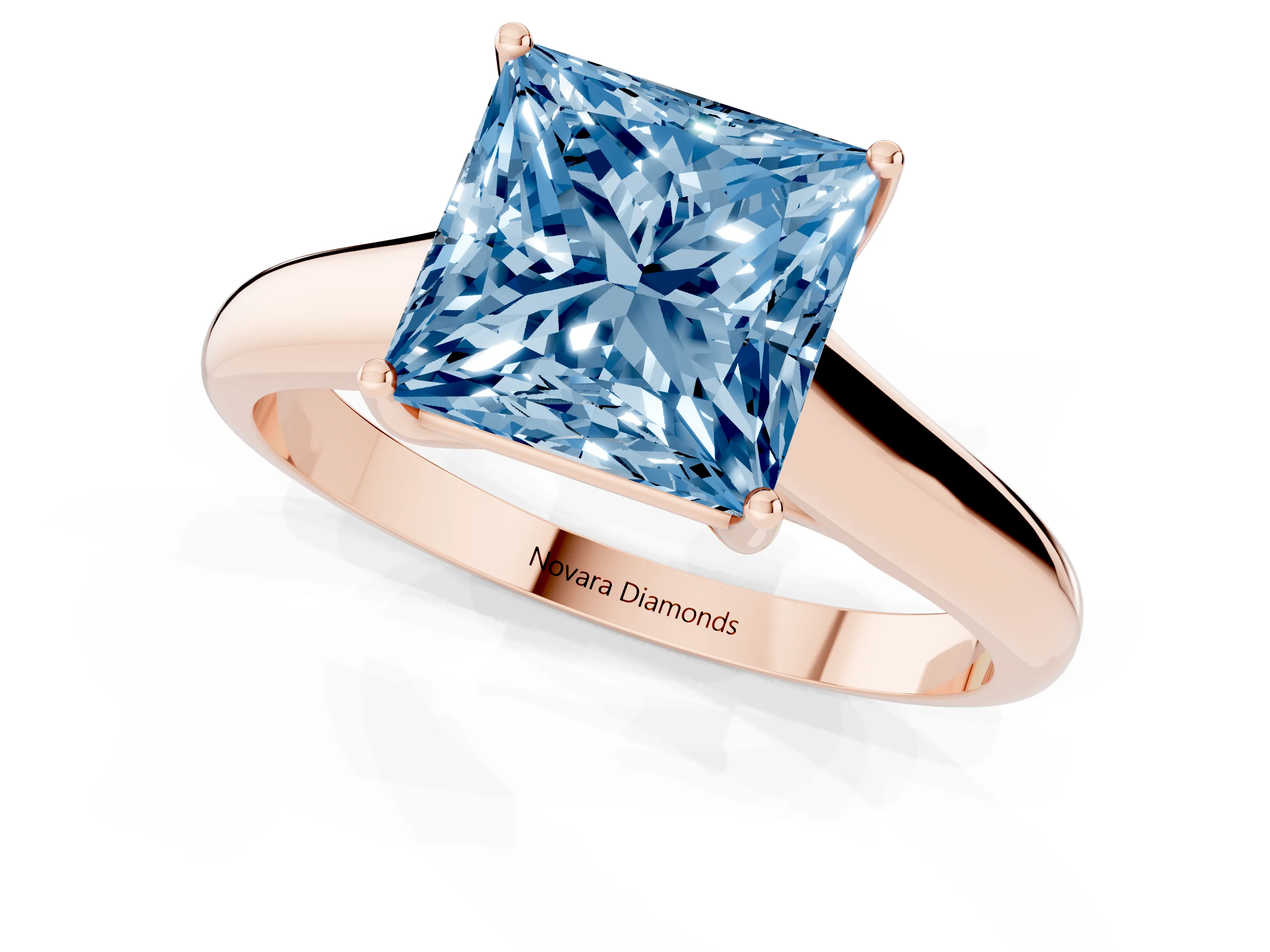Fancy Blue Princess Cut Diamond Solitaire Engagement Ring Set in Rose gold with Subtly Tapered Band and Prong Setting