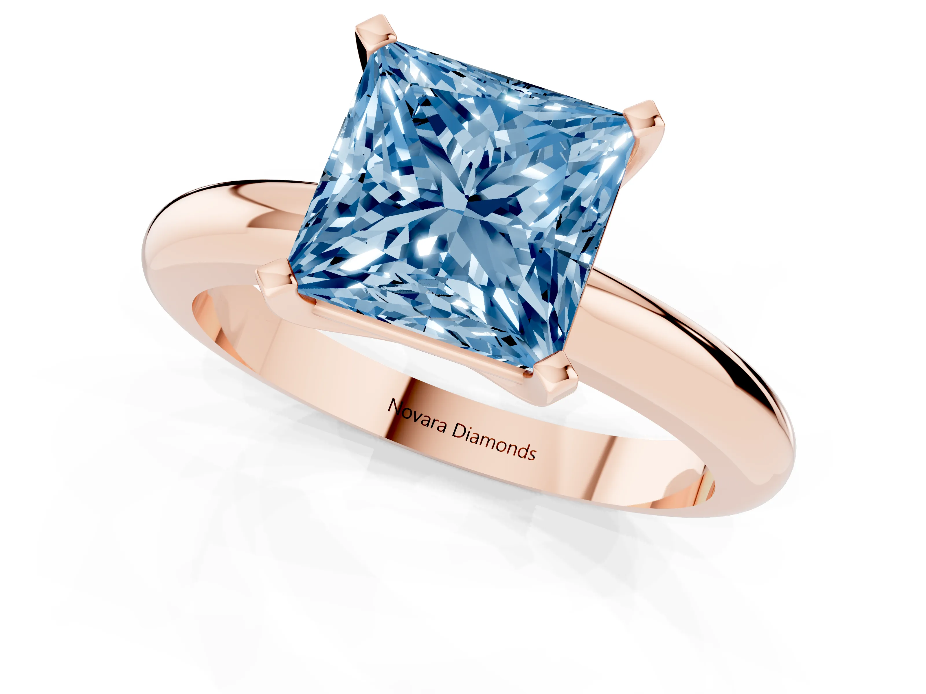 Fancy Blue Princess Cut Diamond Solitaire Engagement Ring Set in Rose gold with Round Band and Prong Setting