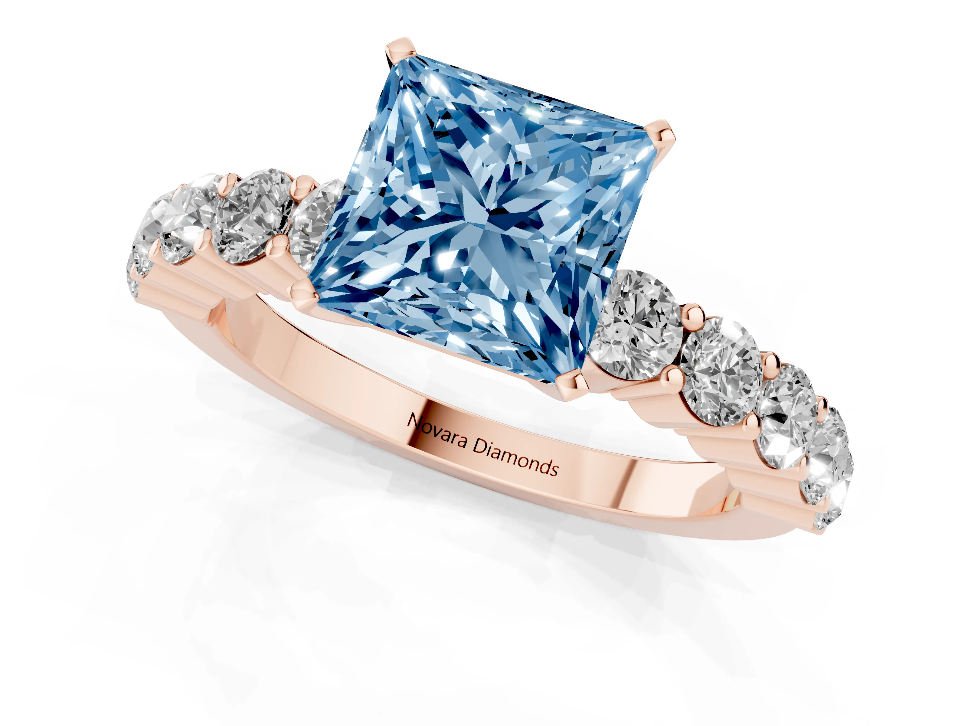 Fancy Blue Princess Cut Diamond Solitaire Ring Set in Rose gold with Shared Prong Round Side Stones