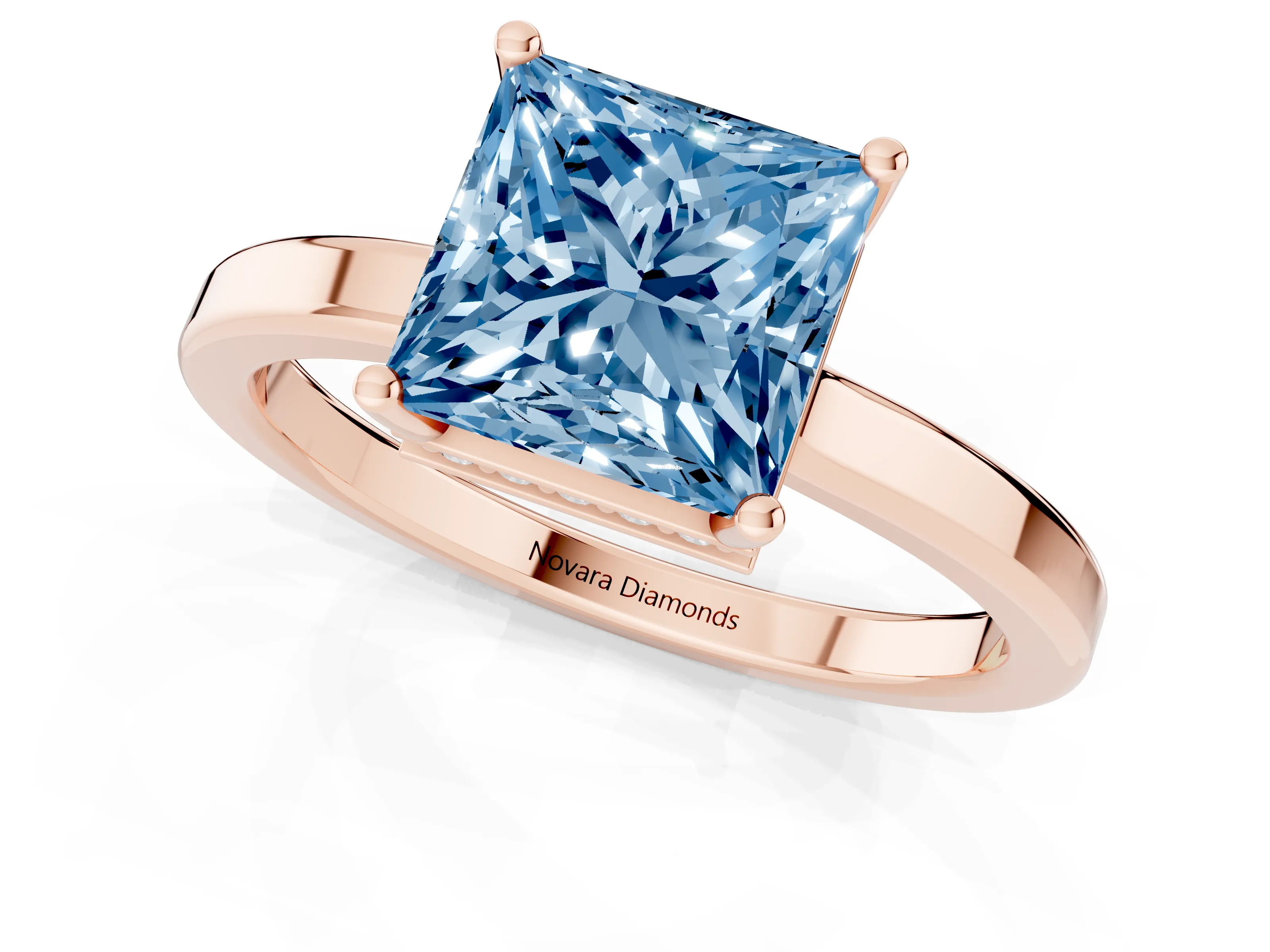 Fancy Blue Princess Cut Diamond Solitaire Engagement Ring Set in Rose gold with Prong Setting on a Plain Band