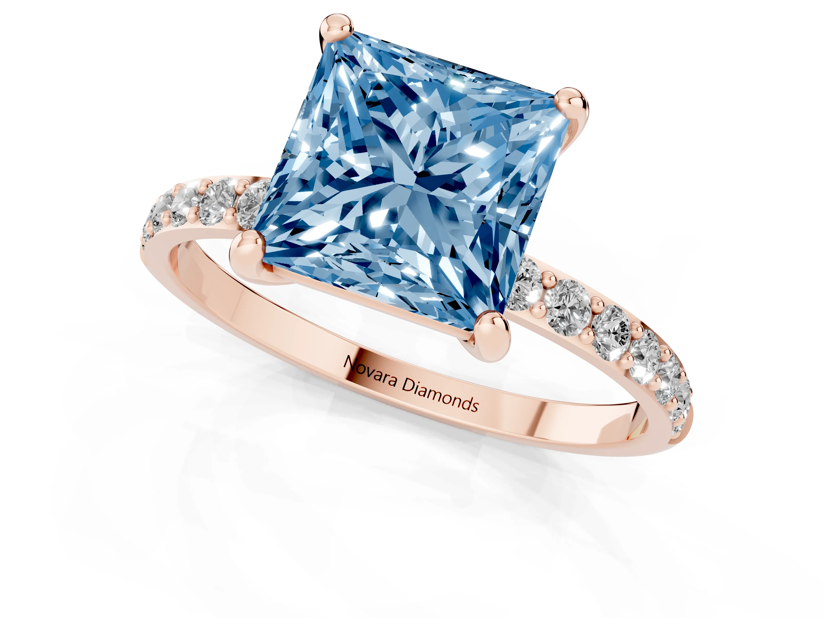 Fancy Blue Princess Cut Diamond Solitaire Ring Set in Rose gold with Round Pavé Band and Prong Setting