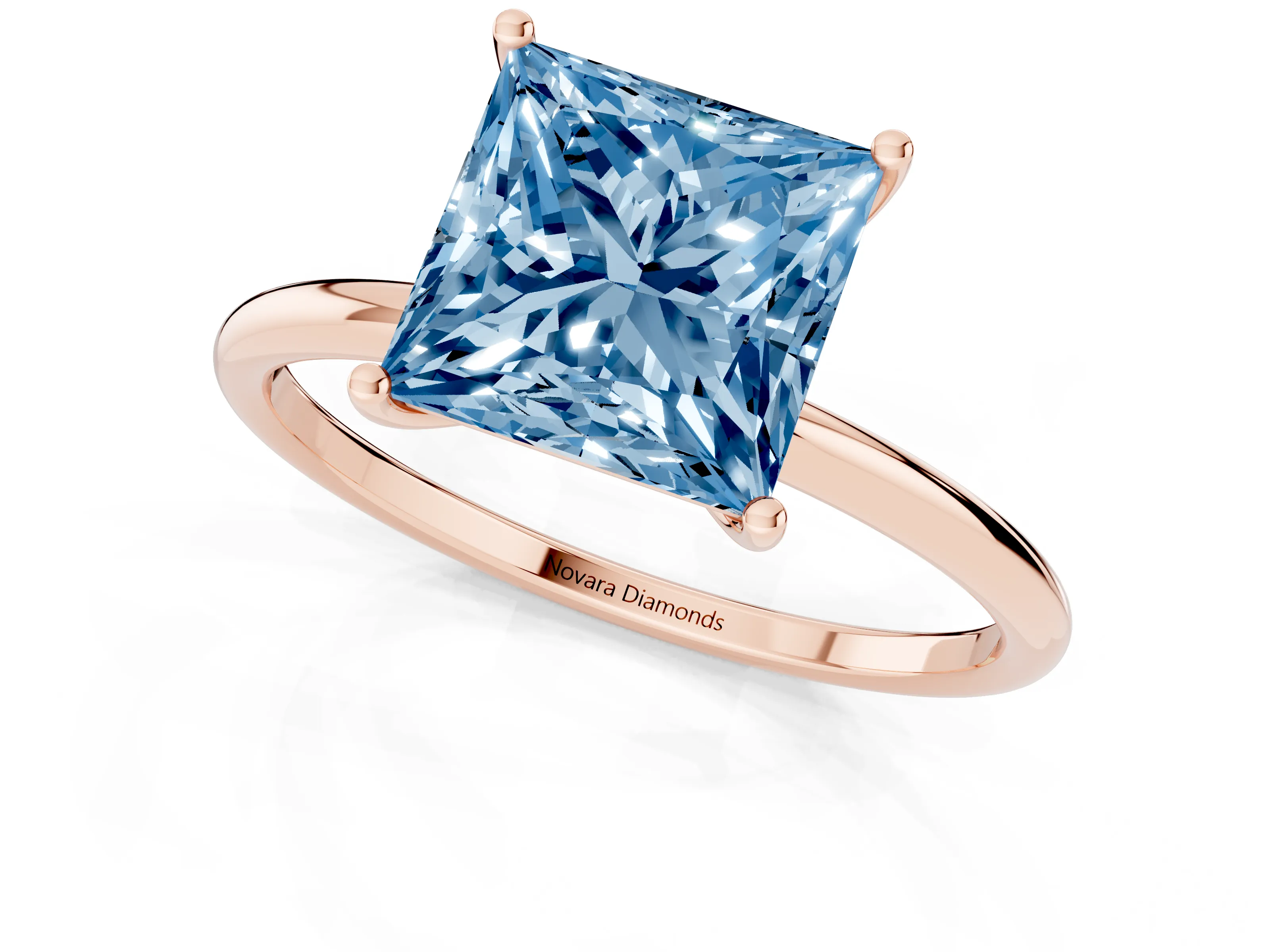 Fancy Blue Princess Cut Diamond Solitaire Engagement Ring Set in Rose gold with Thin Band and Prong Setting