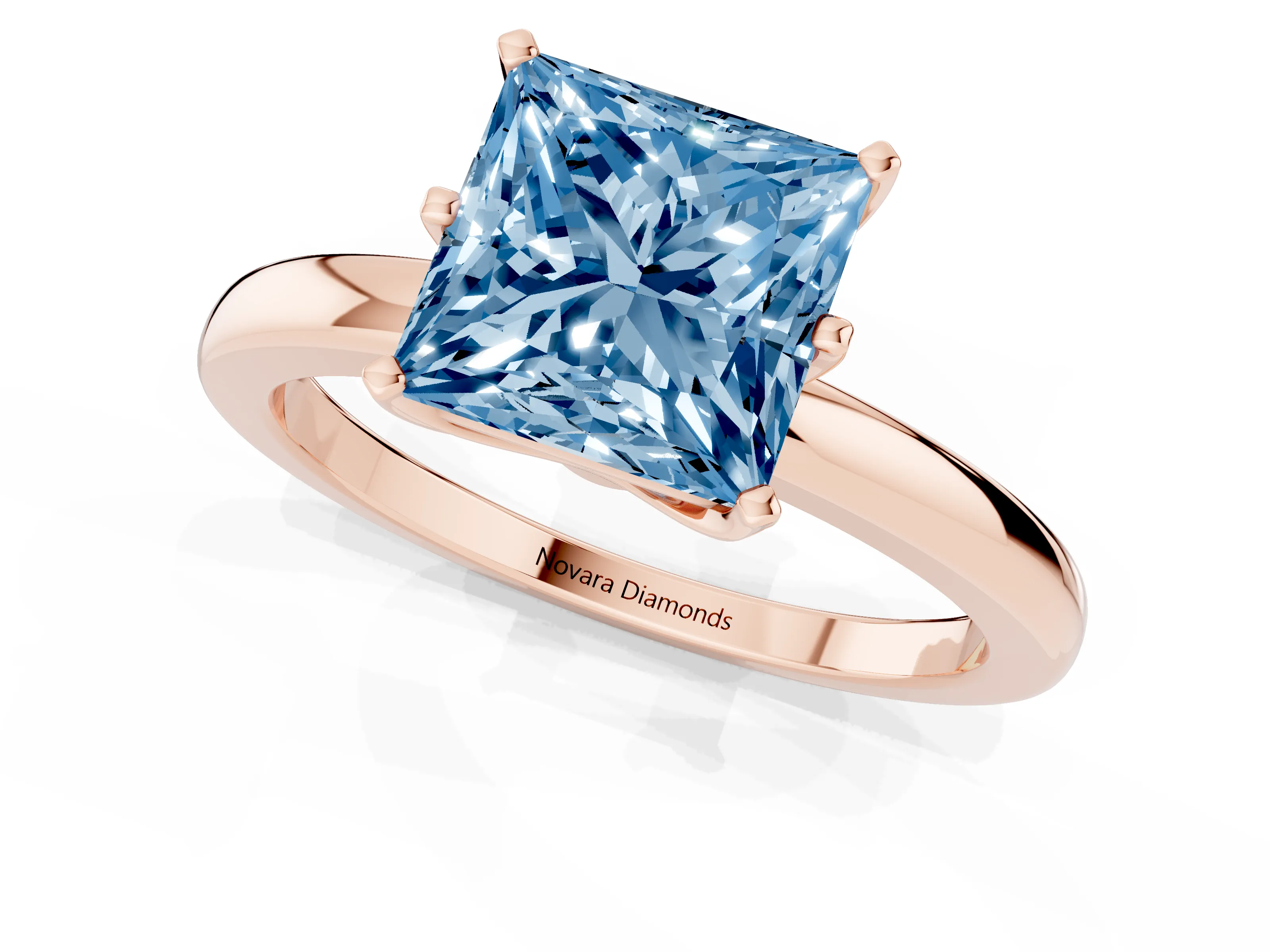 Fancy Blue Princess Cut Diamond Solitaire Ring Set in Rose gold with Raised Prong Setting on a Classic Band