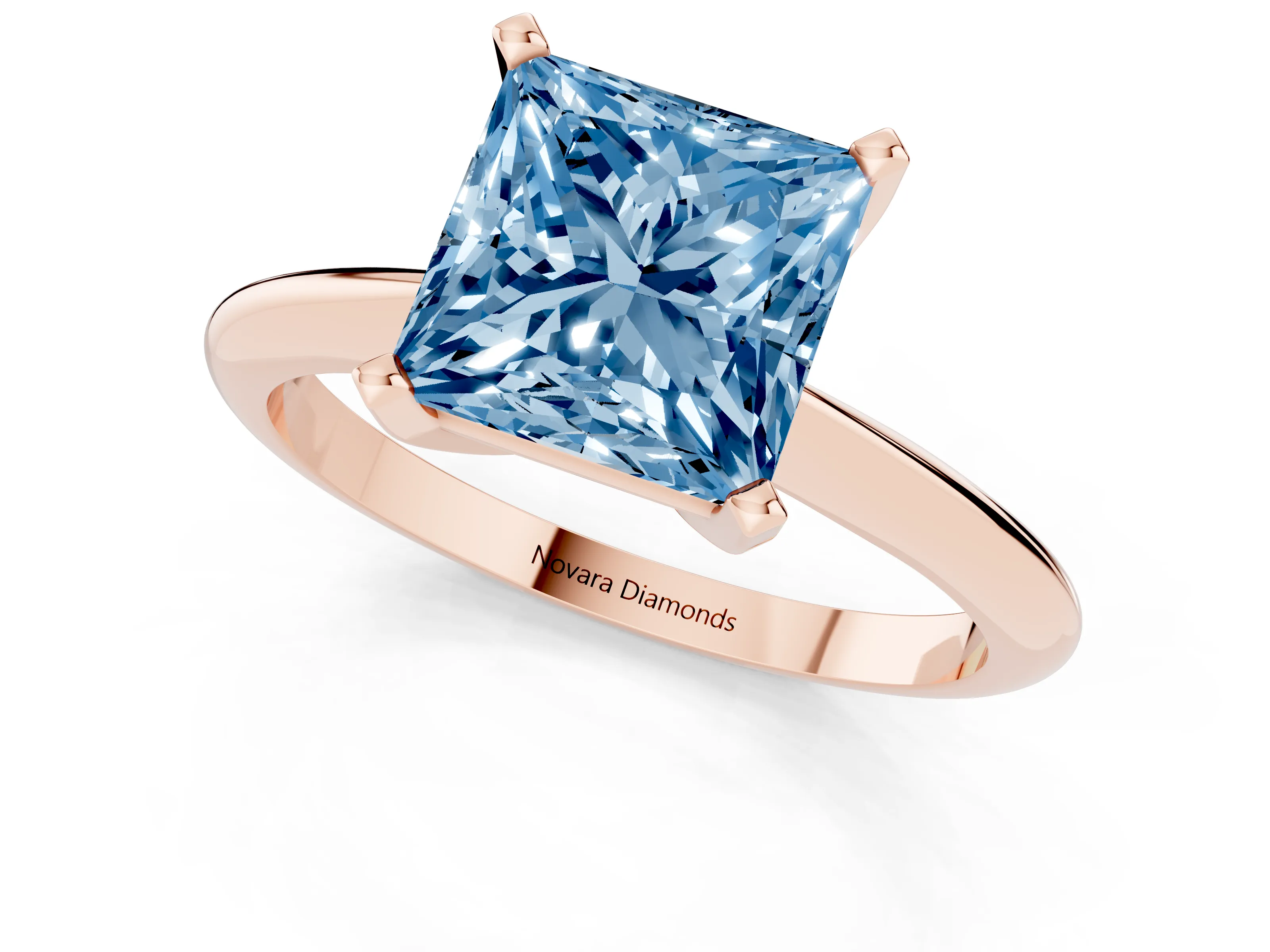 Fancy Blue Princess Cut Diamond Solitaire Ring Set in Rose gold with Prong Setting on a Plain Round Band