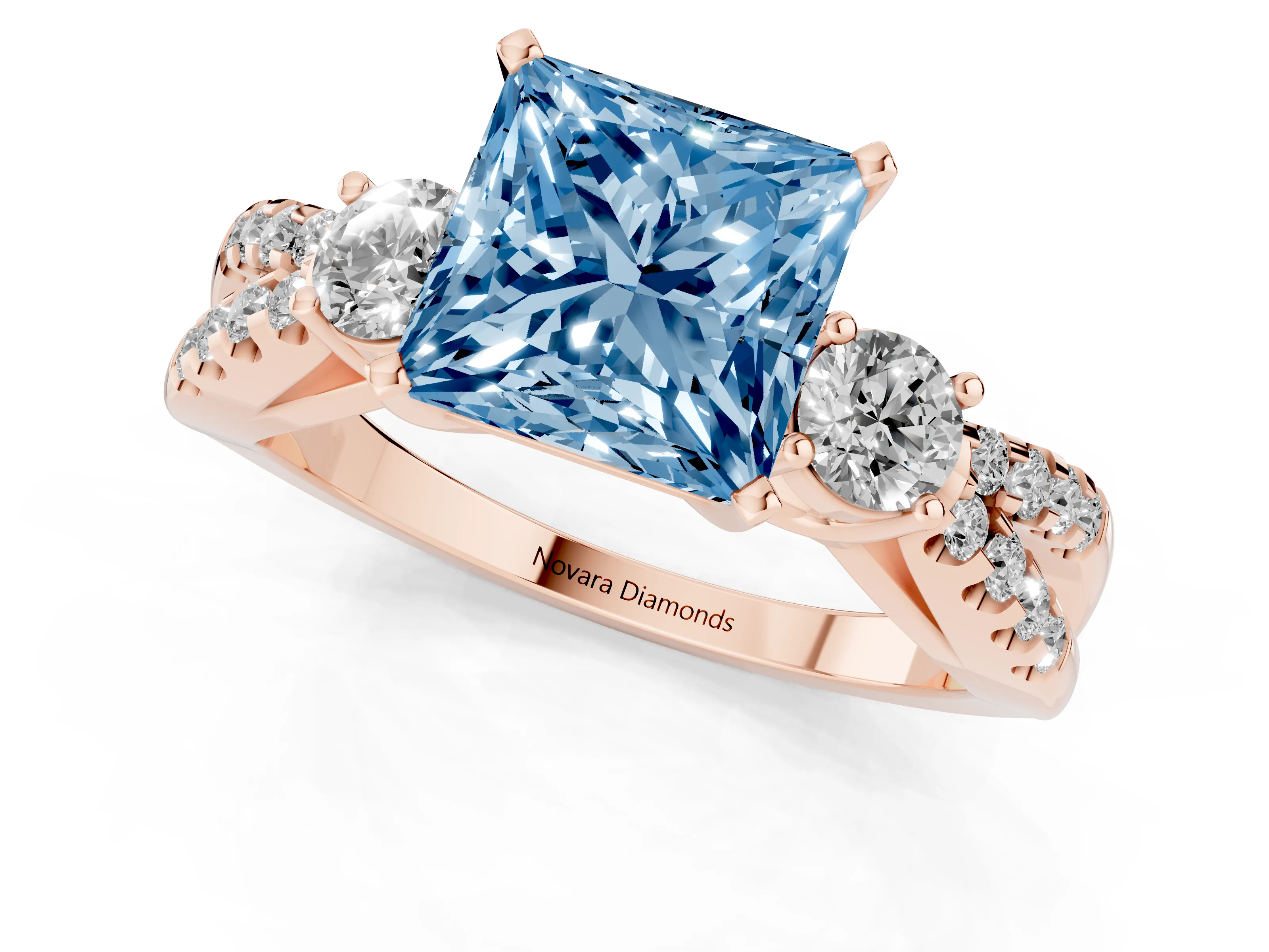 Fancy Blue Princess Cut Diamond Three-Stone Ring Set in Rose gold with Pavé Split Shank and Prong Setting